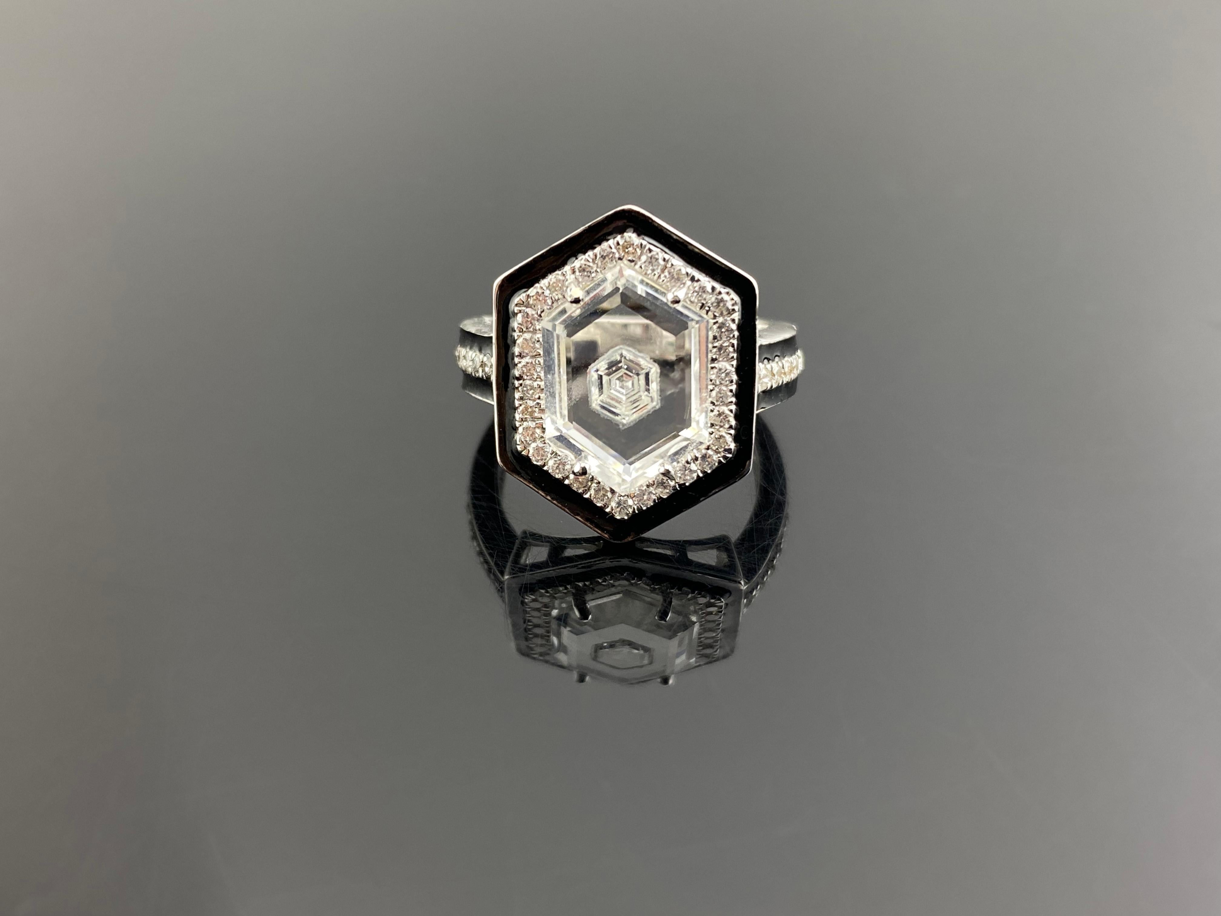 Old world craftsmanship with todays technology, this vintage art deco inspired ring may be even better than others. A stunning 0.15 carat hexagon diamond inlayed in a polished custom cut rock crystal, surrounded by 0.36 carat round diamonds and 5.9