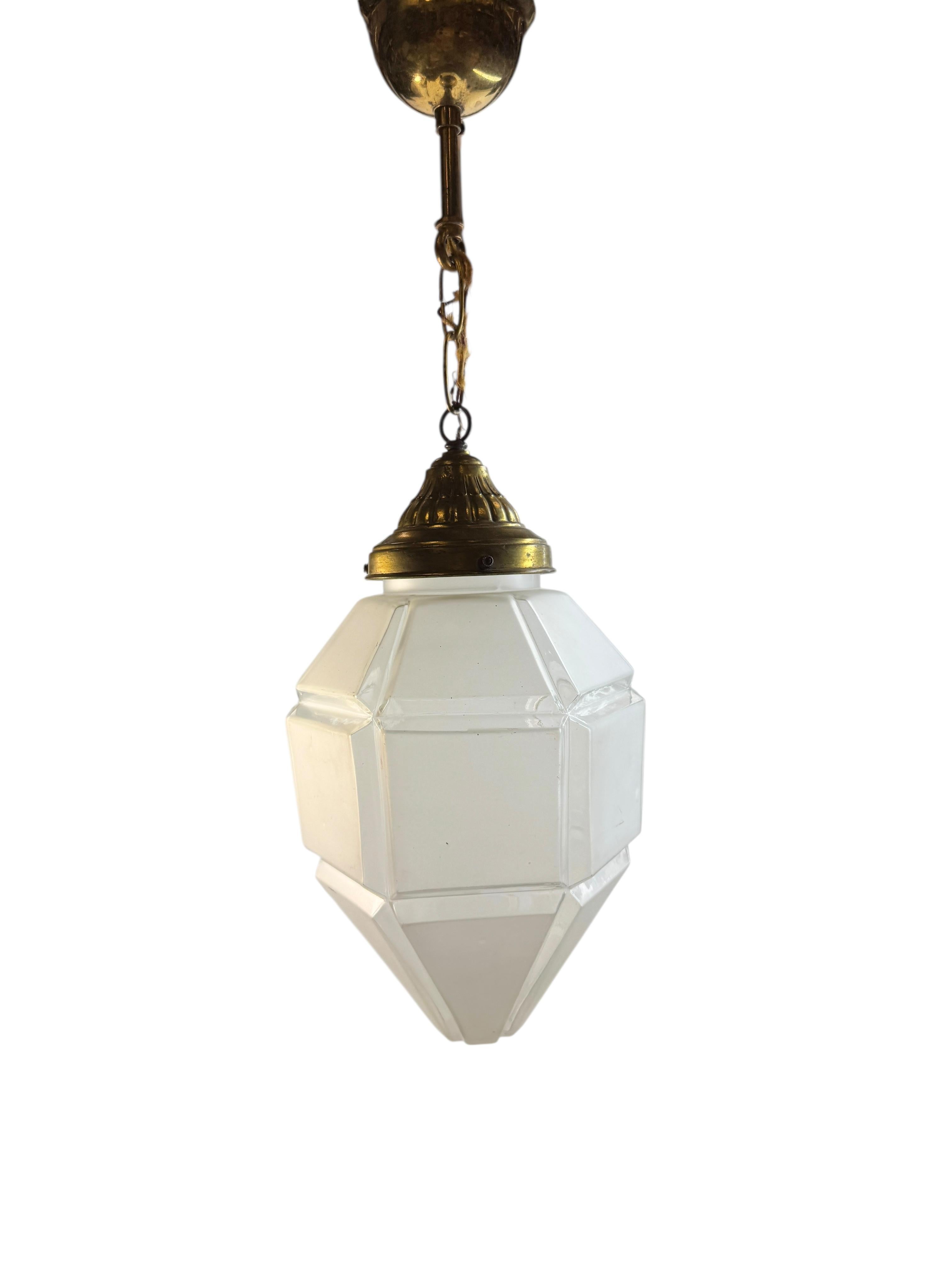 Stunning exceptional 1920s Belgium Art deco pendant light with Brass top and a glass shade. Highly decorative in an Entry hallway or Patio. 
The cable for this item is in original condition and may need to be replaced unless otherwise stated.
Found