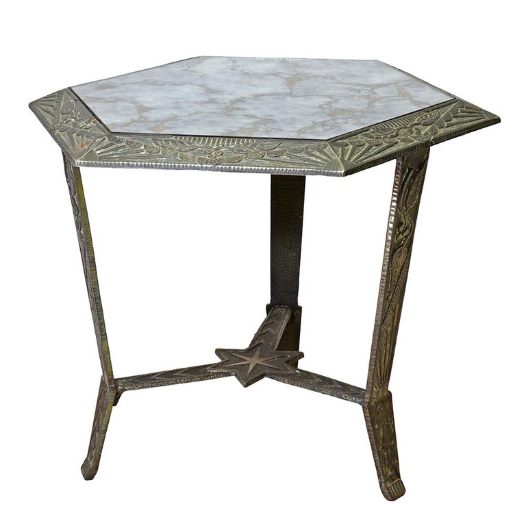 Crafted by Verona Casting Company, this petite hexagonal side table is the perfect Art Deco utility accent. Topped with it original marbled glass, there are sunbursts and geometry galore in its cast details.