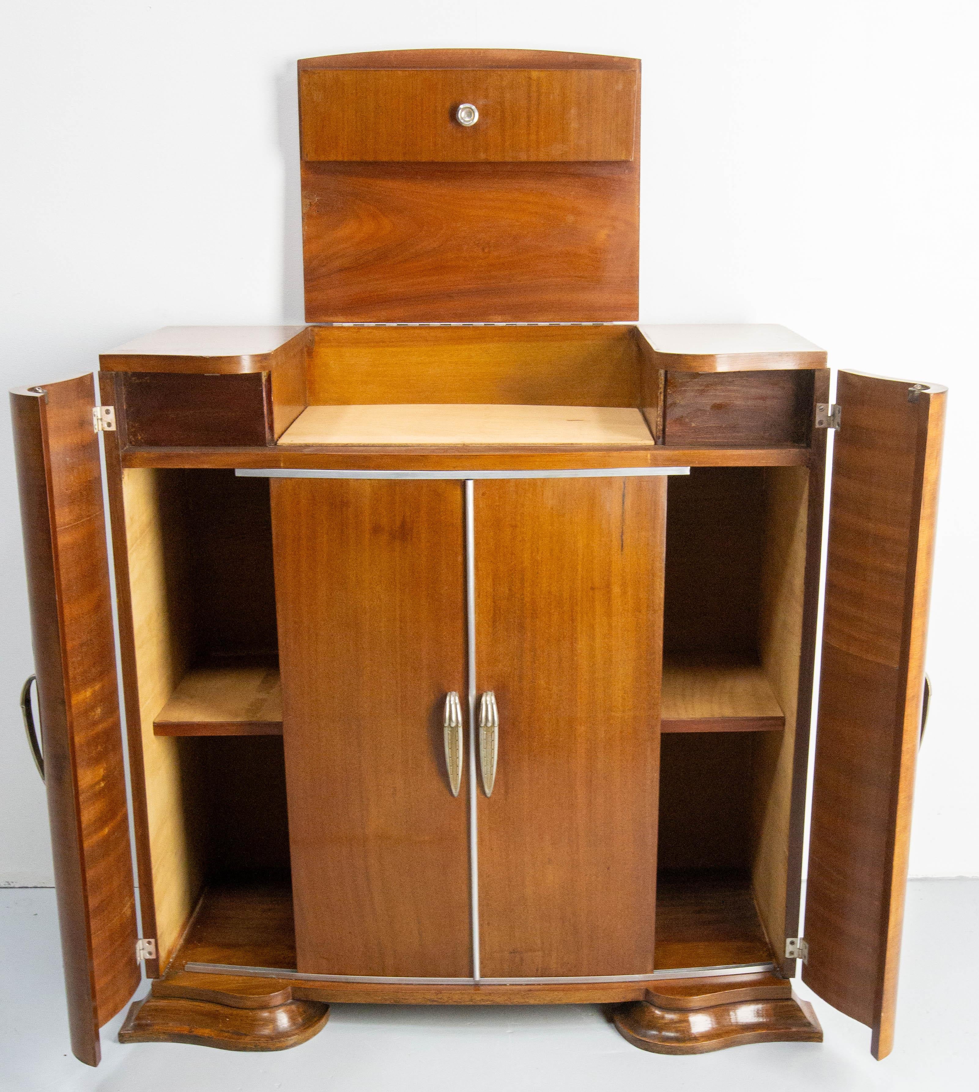 Cocktail Hi Fi cabinet Art Deco, French, circa 1930
The two middle doors are sliding
Burr exotic wood and chrome
Very unusual, some parts of the inside wood where replaced some years before
Dimensions: 
opening of the sliding doors: 12