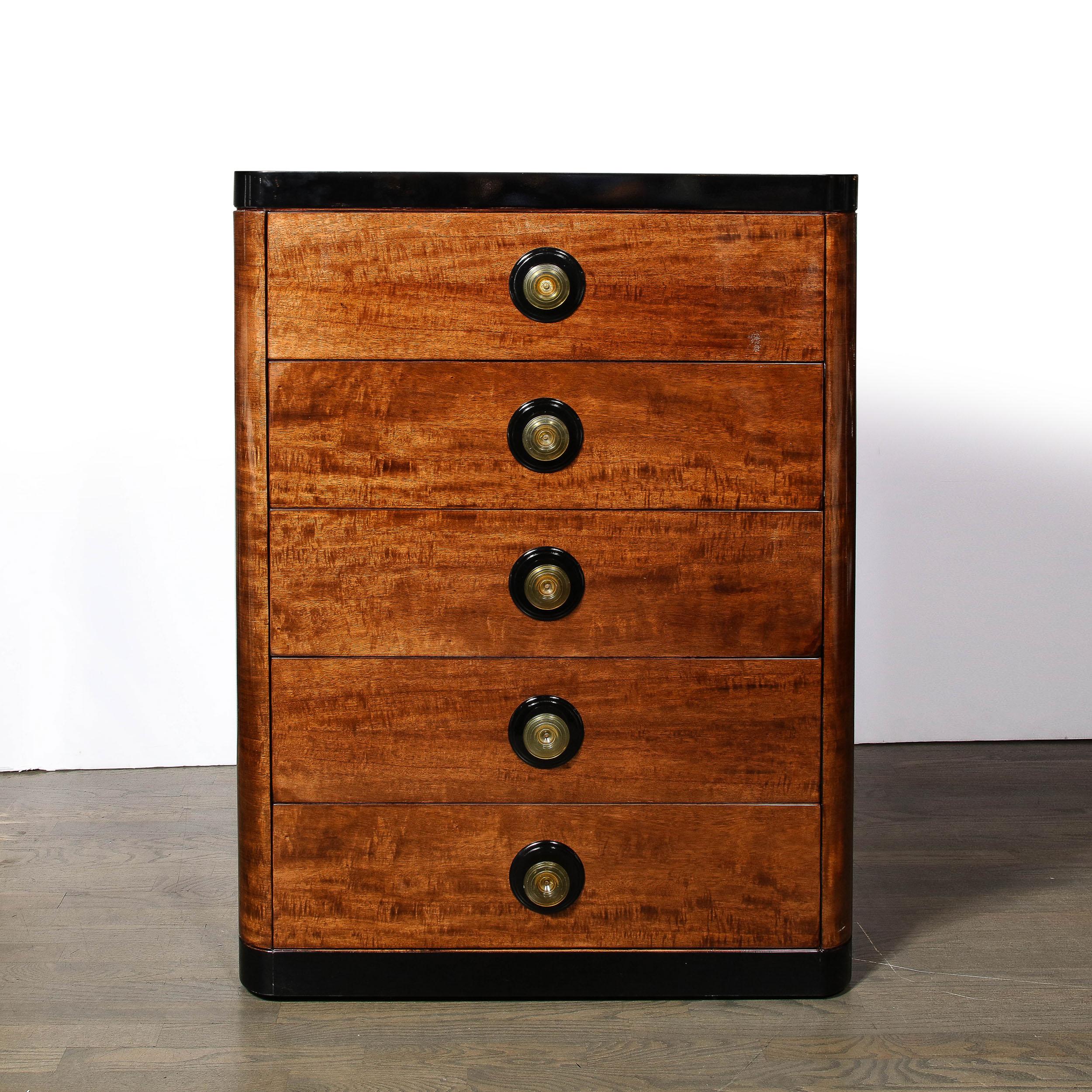 This Art Deco Machine Age High Chest in Book-matched and Burled Walnut with Amber Bakelite Pulls originates from the United States, Circa 1935. Streamlined and utilizing beautiful geometric proportions characteristic of period Art Deco designs,