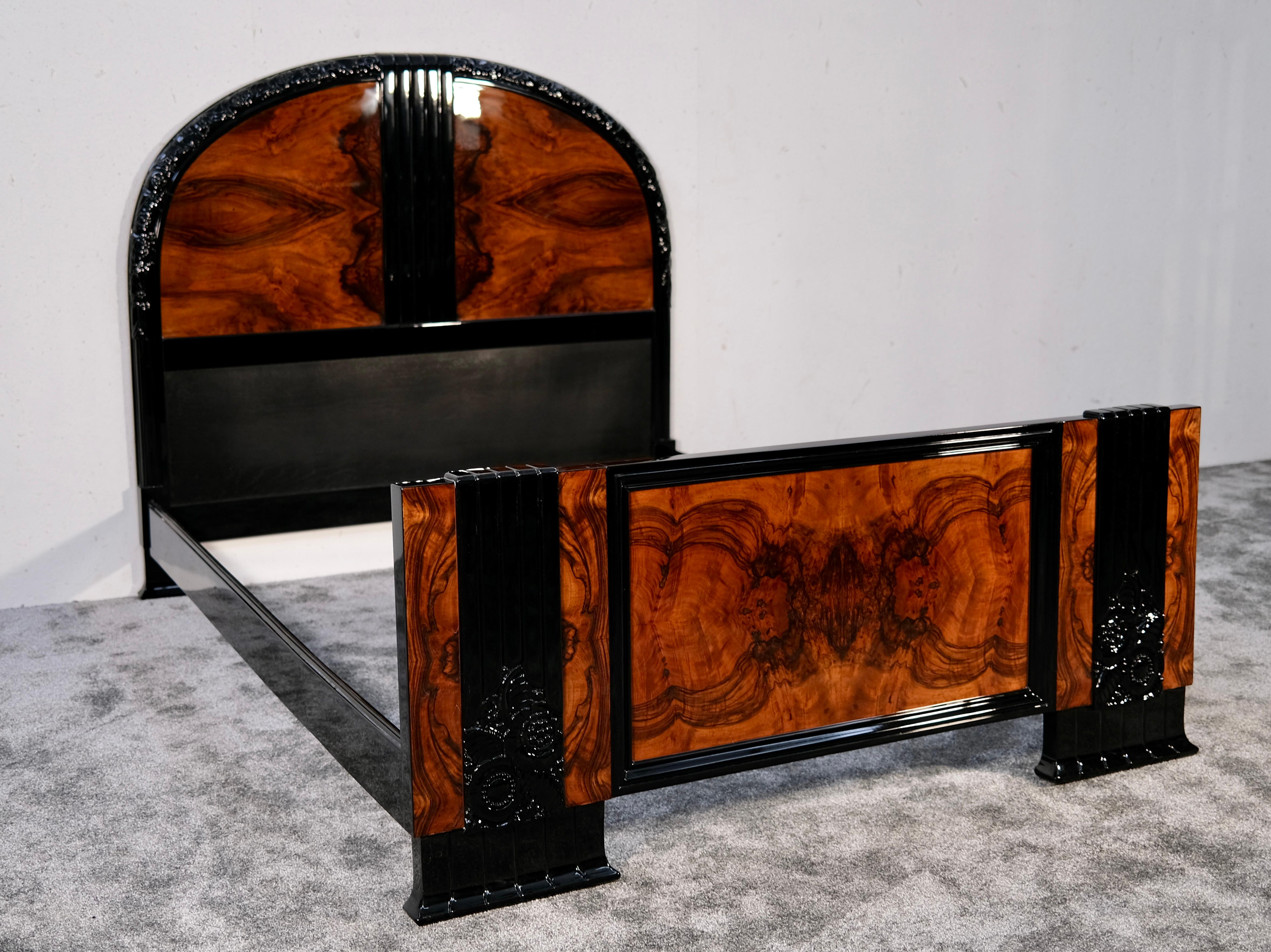 This exquisite Art Deco bed frame from 1930s France is a true dream furniture piece, where elegance, craftsmanship, and history come together in perfect harmony. Crafted from richly grained nut wood veneer, its warm, organic patterns are beautifully