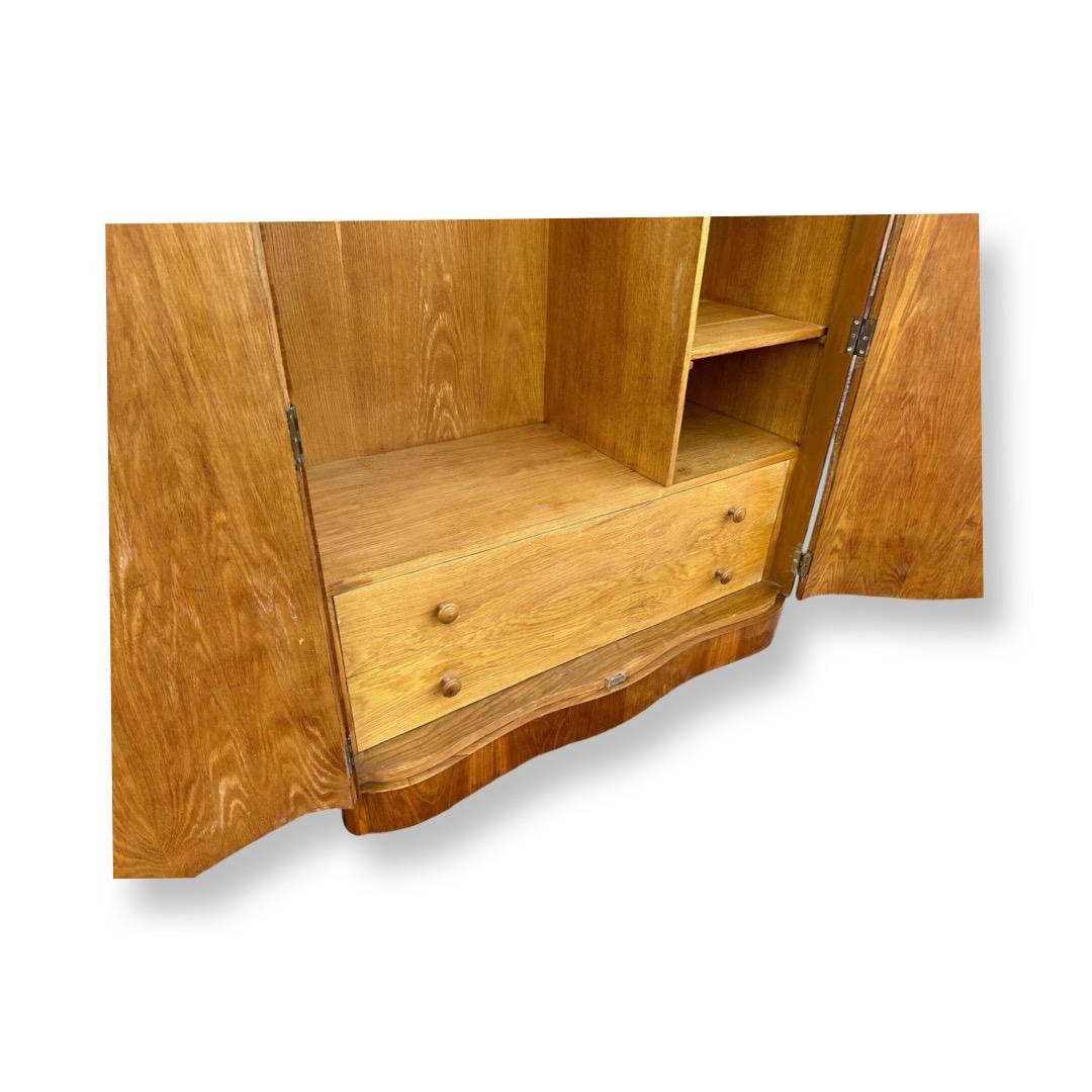 Art Deco highly figured walnut serpentine wardrobe For Sale at 1stDibs