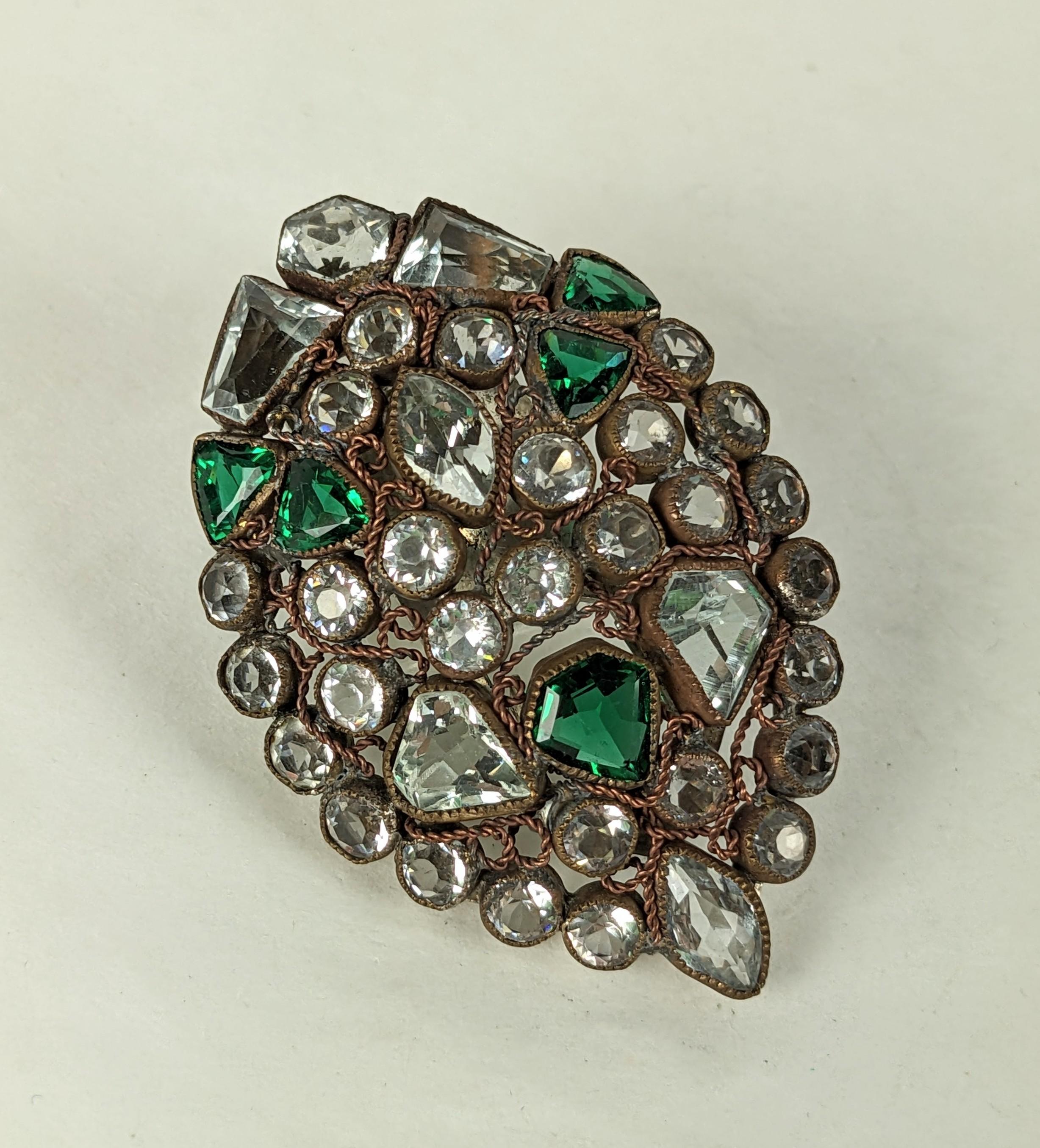 Art Deco Hobe Jeweled Clip from the 1920's with sterling clip fitting. Crystal and emerald pastes in varied cuts are set in typical Hobe setting in a marquise shaped clip. 
1920's USA. Unsigned, Clip signed Sterling. Measures 2