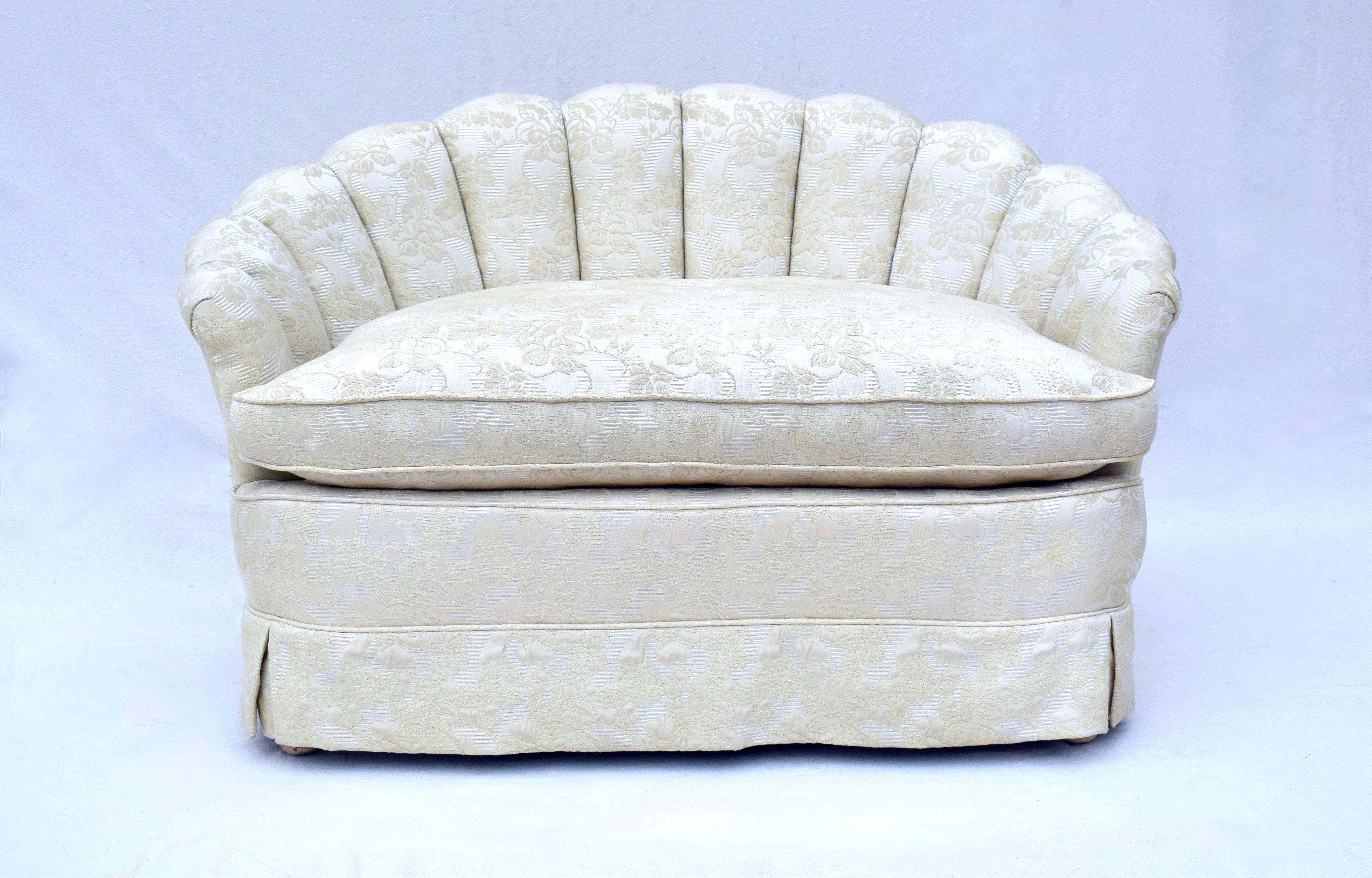 1940's Art Deco Hollywood Regency Channel back petit loveseat in exquisite vintage condition and exceptionally well maintained brocade floral upholstery. Aesthetically striking, enveloping and comfortable. Seat: 23