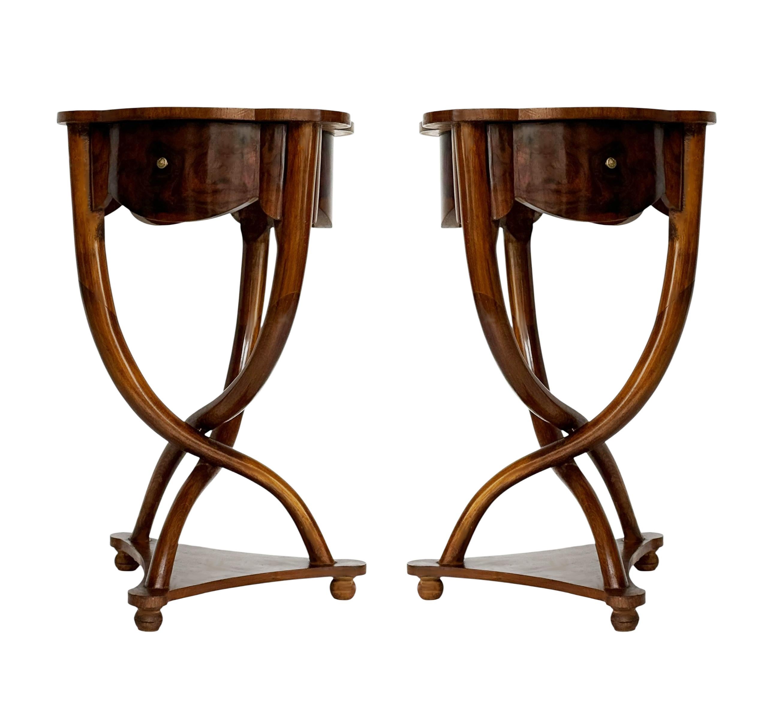 A very nice matching pair of walnut burl end tables that would make a great pair of nightstands. They feature solid wood construction with bookmatched burl tops and one drawer. 