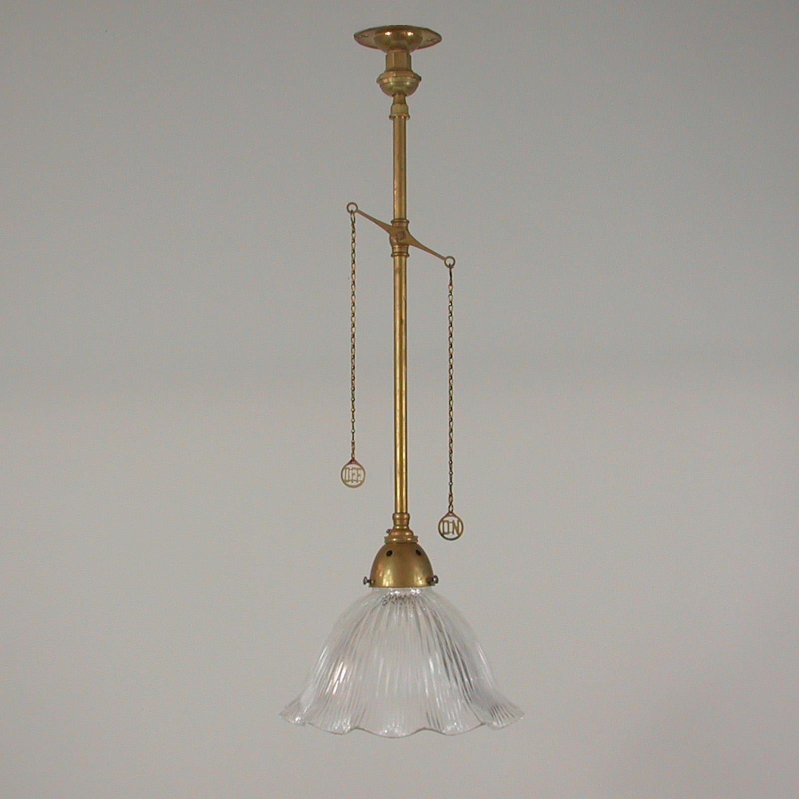 English Art Deco Holophane Glass and Aged Brass Pendants, 1920s, Set of Two For Sale