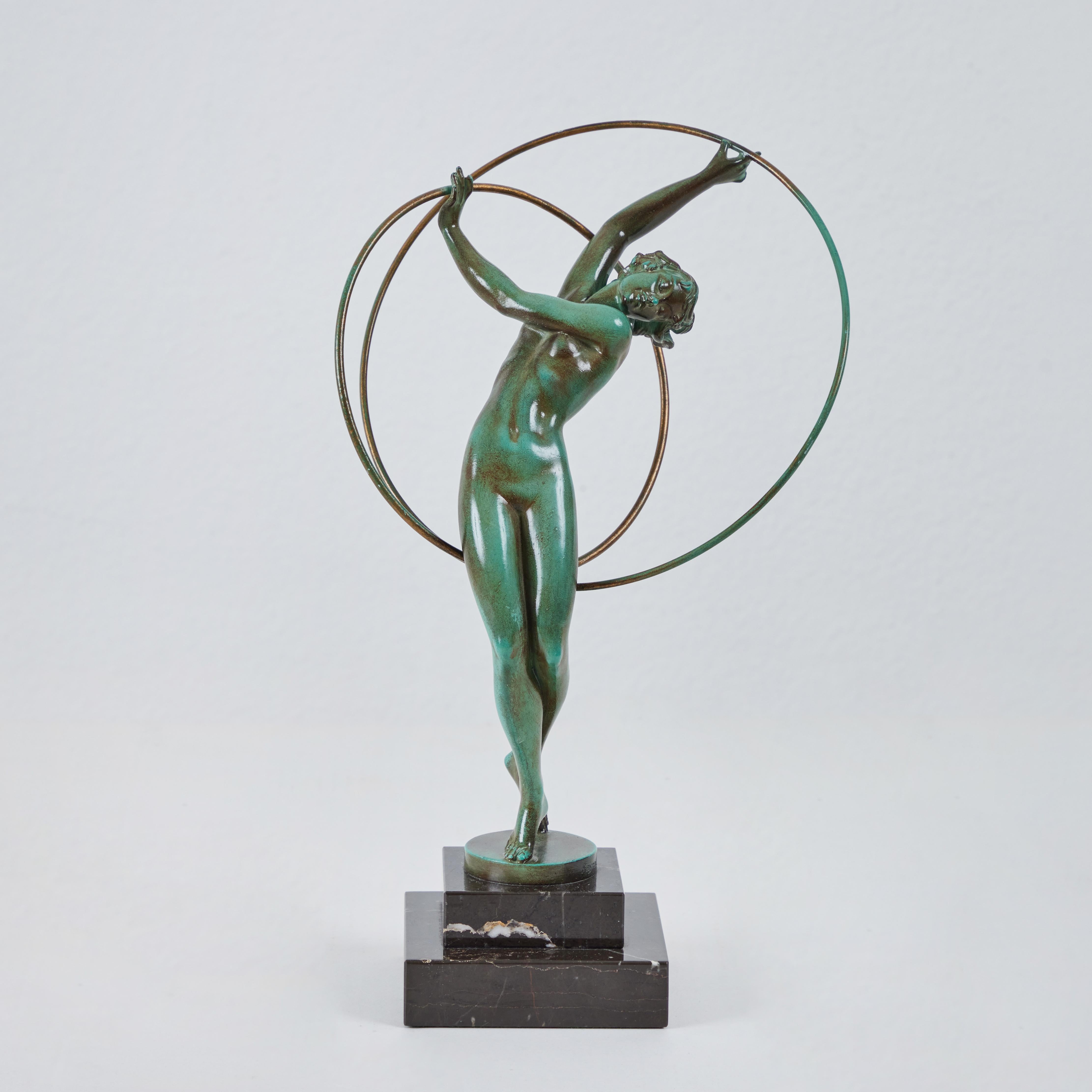 This hoop dancer sculpture by Pierre Le Faguay, signed his pseudonym 