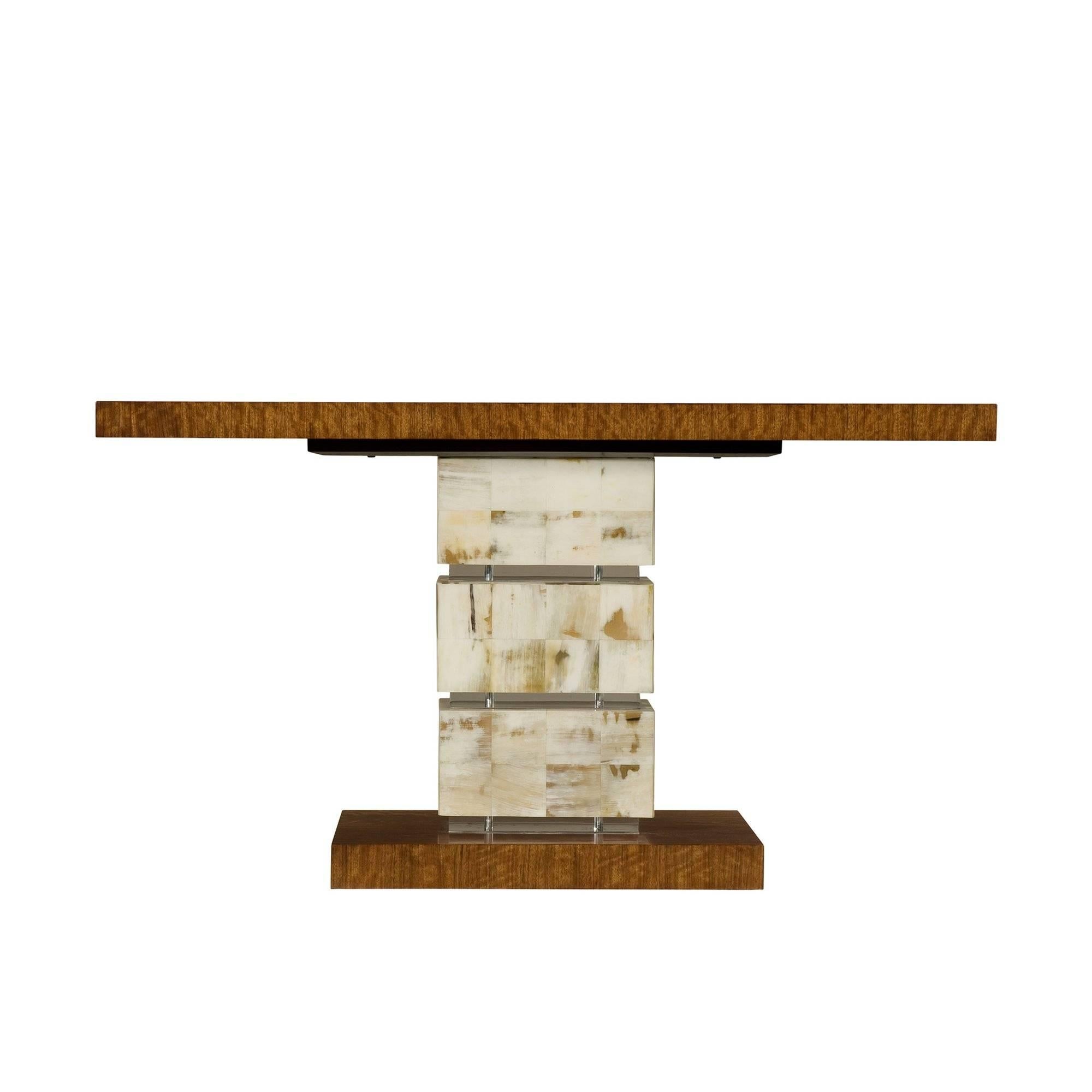 A Hyedua veneered console table, the rectangular top above three horn panelled and three acrylic blocks, on a plinth base.