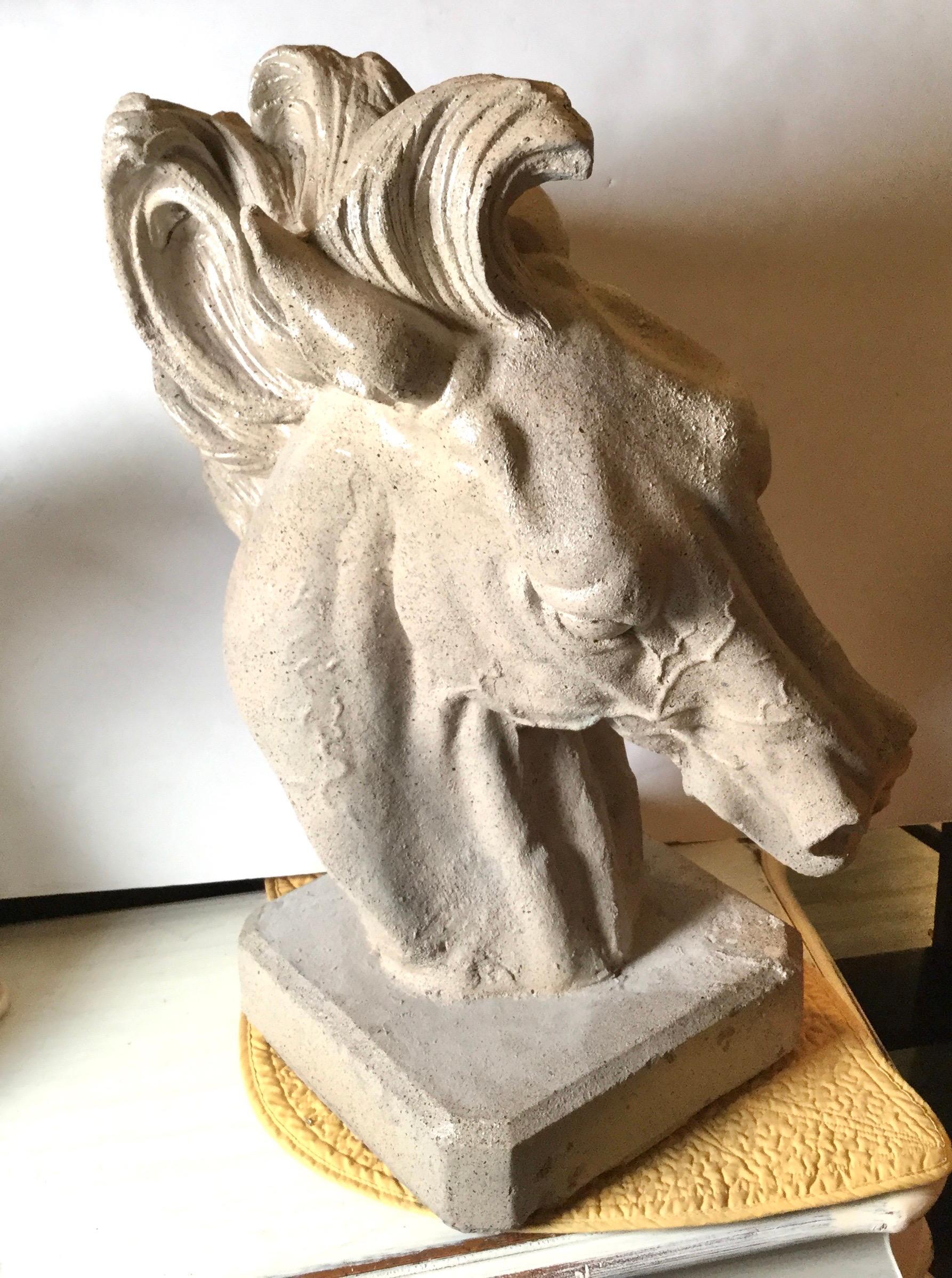 Art Deco stylized horse head with flowing mane with fine details. Made of concrete that has been treated and polished so it can be used inside or out. Very heavy about 100lbs. Base is 11