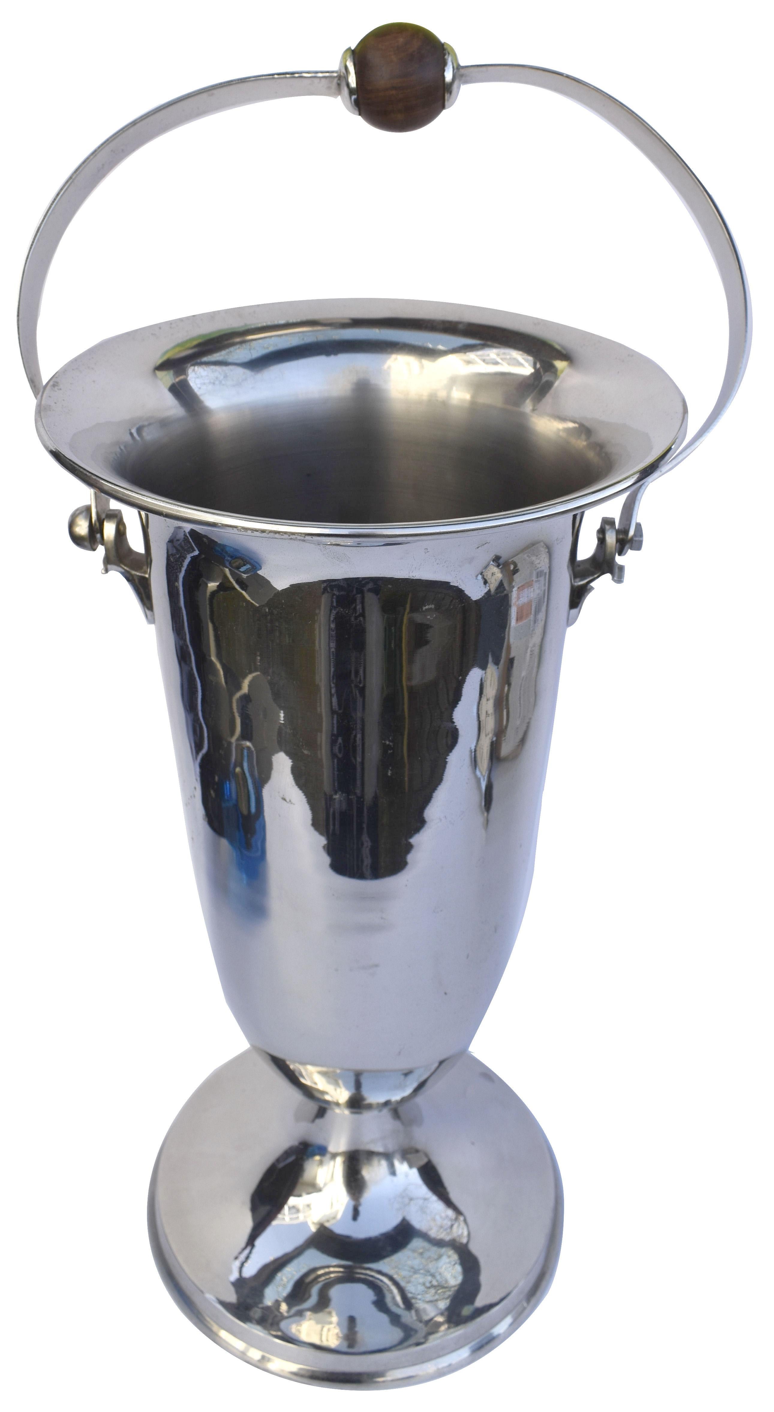 For entertaining in style we present to you this hugely stylish and huge in size Art Deco wine cooler/ ice bucket, dating to the 1930's and originating from France. Standing a whopping 41 cm high and with handle 55.5cm this over sized cooler is