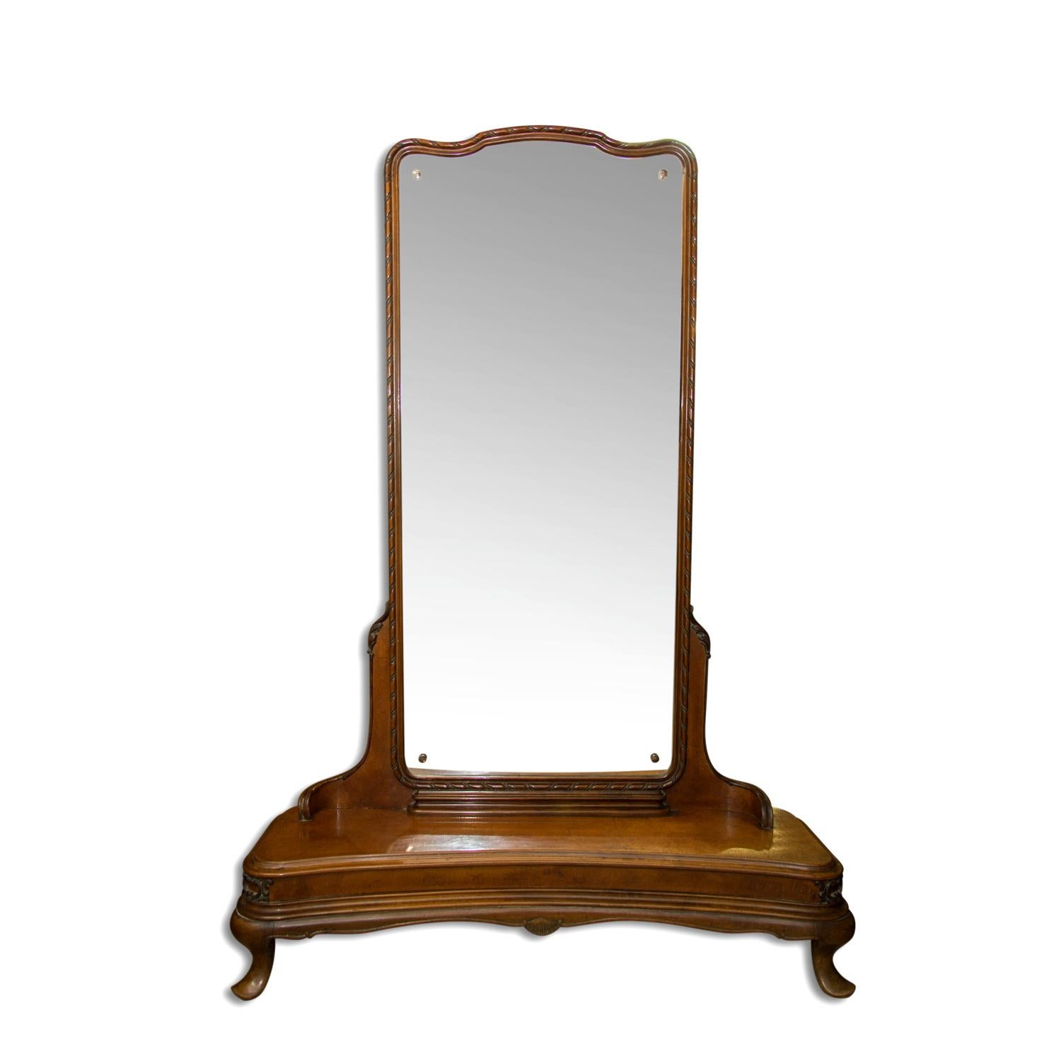This Art Deco huge mirror or dressing table was made in Bohemia in the 1920s. It´s made of walnut It´s on a wide base with rectangular mirror. Very interesting design.
In very good vintage condition.