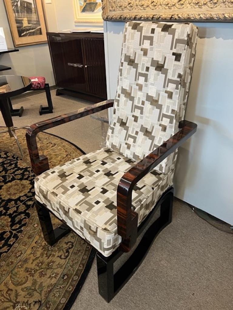 Great veneer selection. Walnut and Ebony. 
 Chair has wooden frame that is nicely contrasted to the light fabric. It has wide handles and legs are connected with each other to make chair more stable. 

Restored. Designed by Farkas