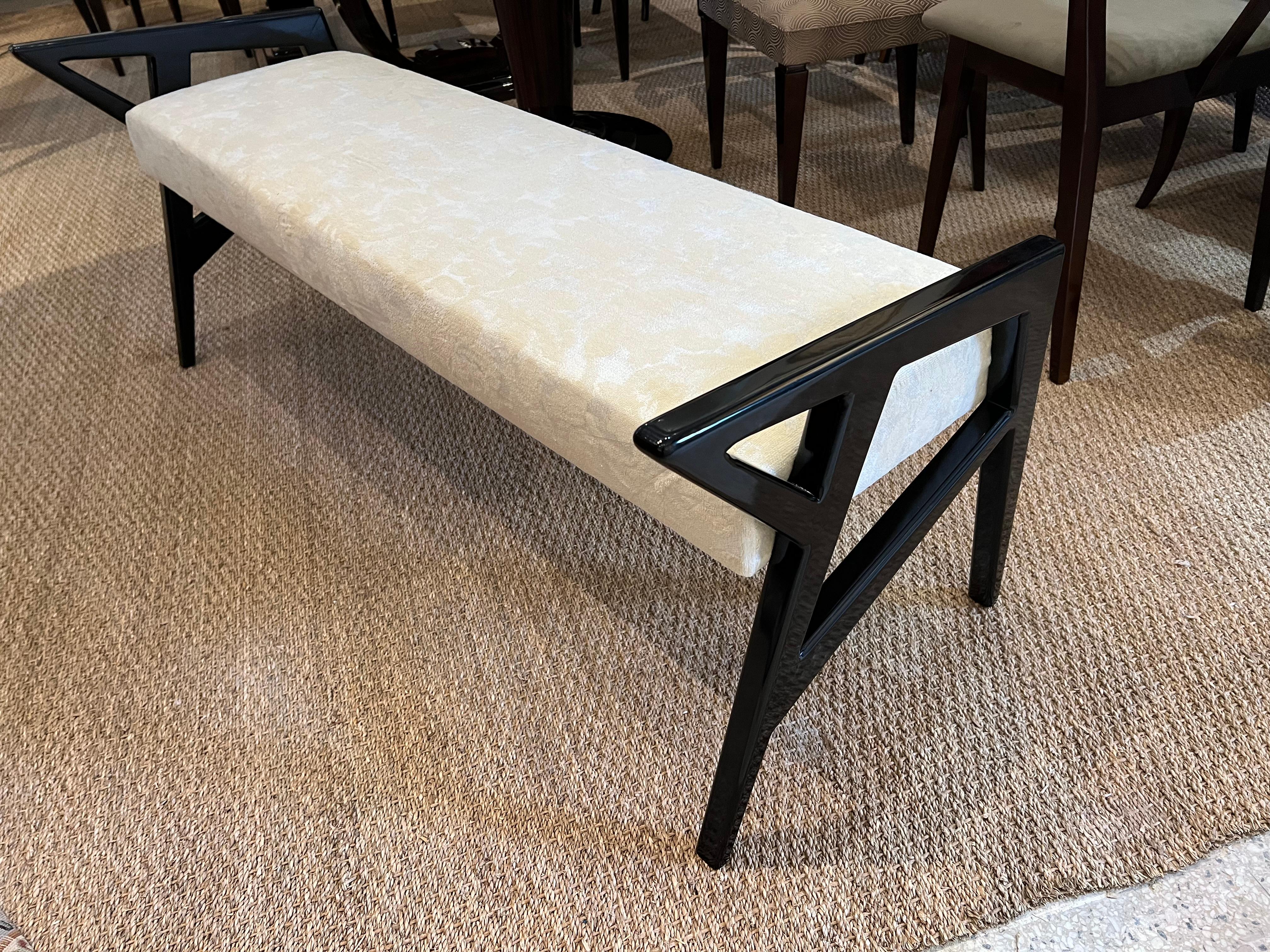 The bench is made out of walnut wood. Newly re-upholstered in light  fabric. Bench has ebonized armrests on each of the sides that are connected with supporting legs. 
 Condition is perfect. Restored and re-upholstered,

 Hungary, circa 1930s
 

