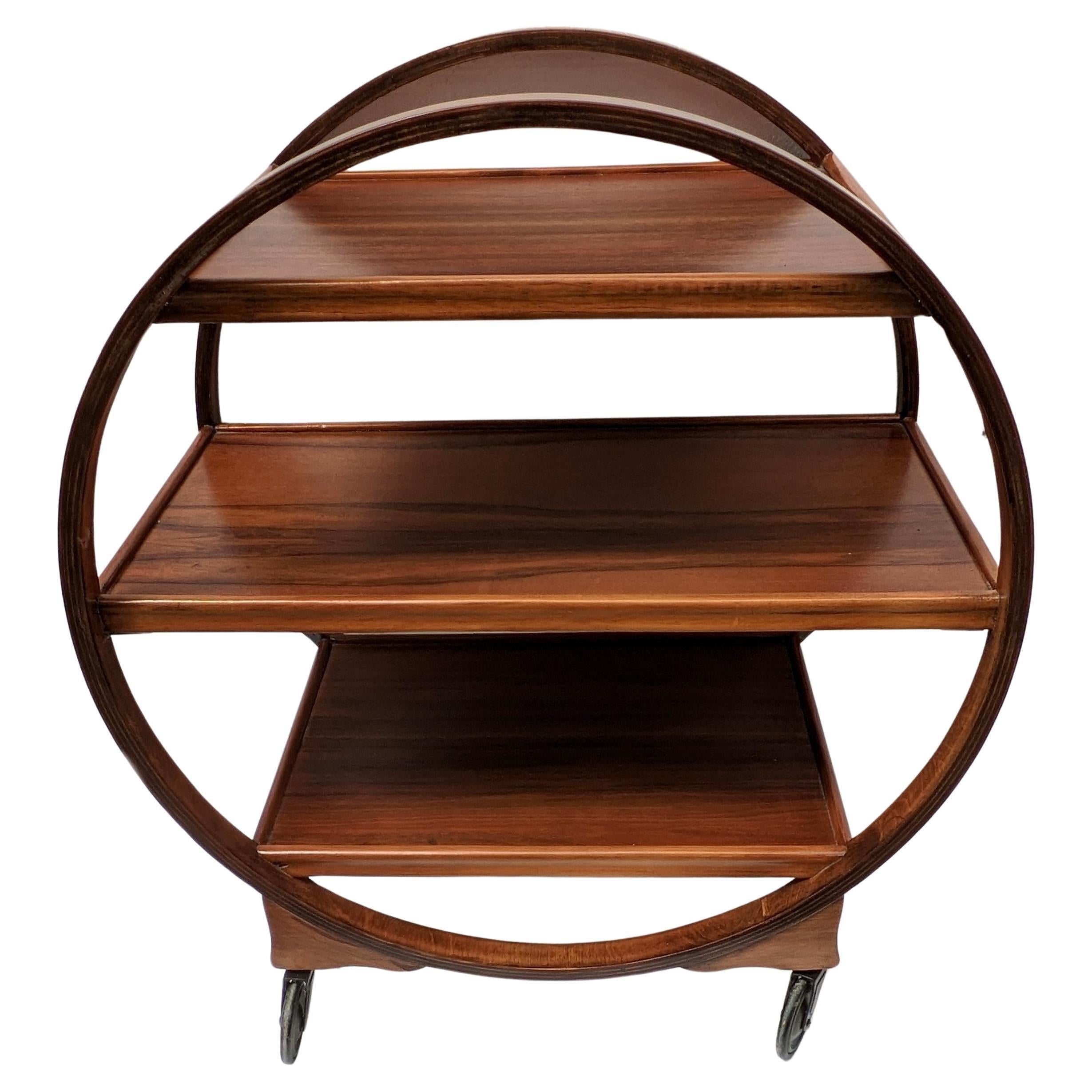 For your consideration is this original and very attractive iconic English Art Deco Savoy Hostess trolley cart dating from the 1920s-1930s period. This three-tiered trolley not only looks impressive but is very functional too. Solid walnut in a warm