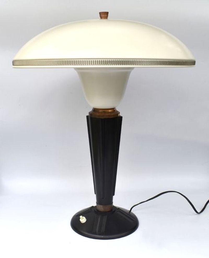 Designed by Eileen Gray for the French Jumo company and dating to the 1930's this very stylish lamp is made from two primary components which are bakelite and metal. Superb mushroom shape enamelled metal shade with copper & silver accents and