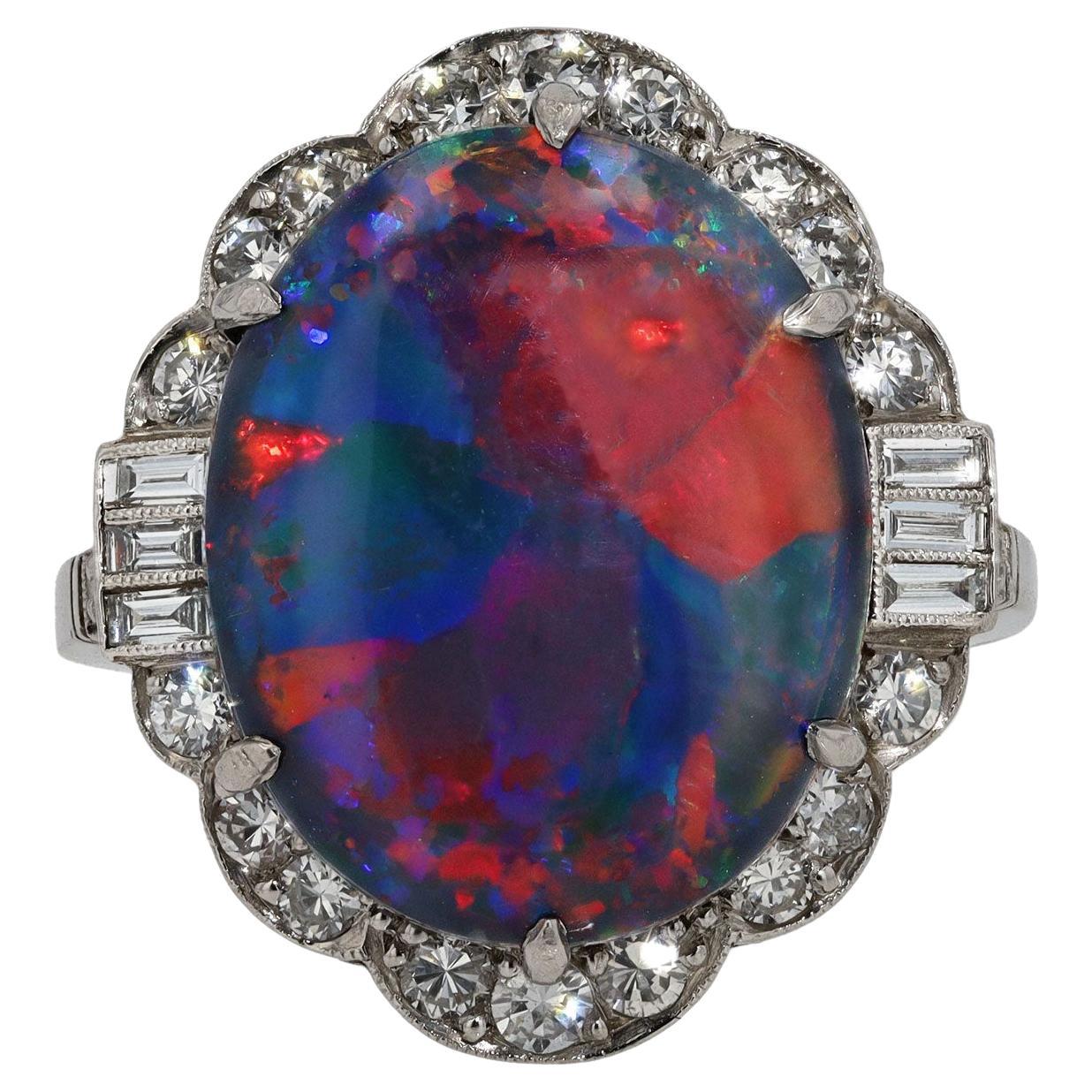 A magnificent Art Deco opal cocktail ring. Being one of the rarest and sought after gemstones, this Lightning Ridge Australian black opal is a top quality collectors' specimen. Known as a harlequin for its distinctive colored patches that displays a