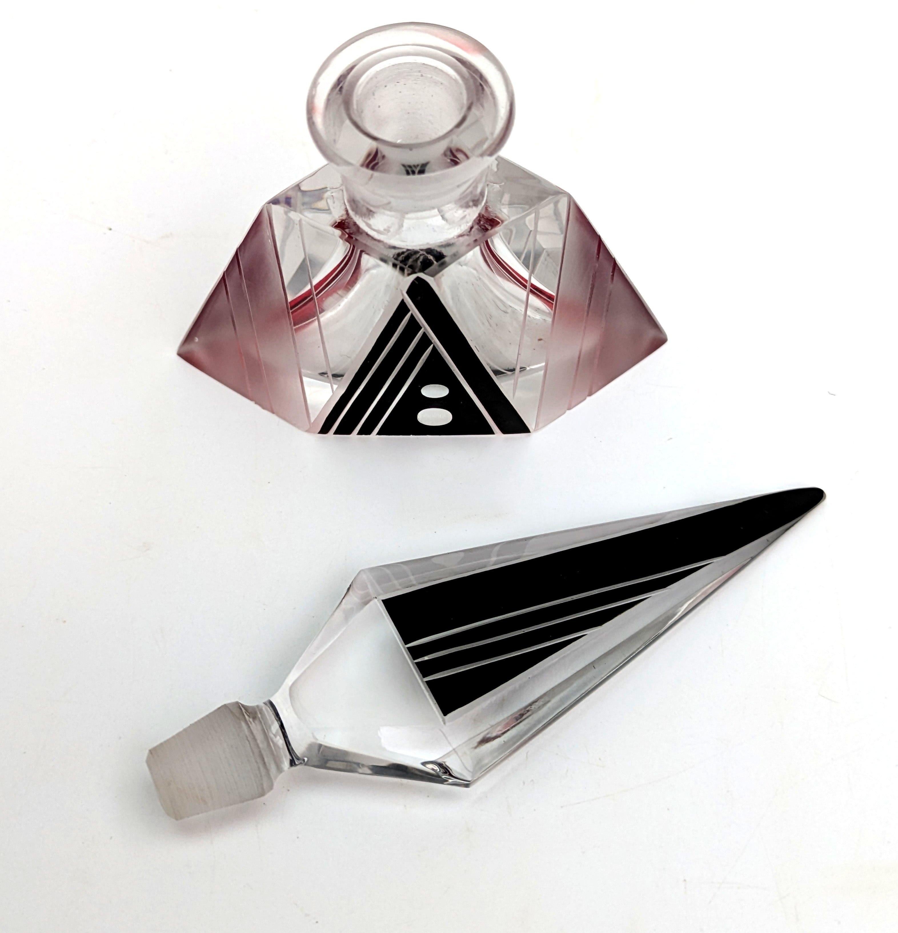 Beautiful Art Deco Czech perfume bottle dating from the 1930s. Features a clear glass bottle with original stopper with jet black and red enamel decoration with exquisite acid etched detailing. A lot of work has gone into the decoration of this