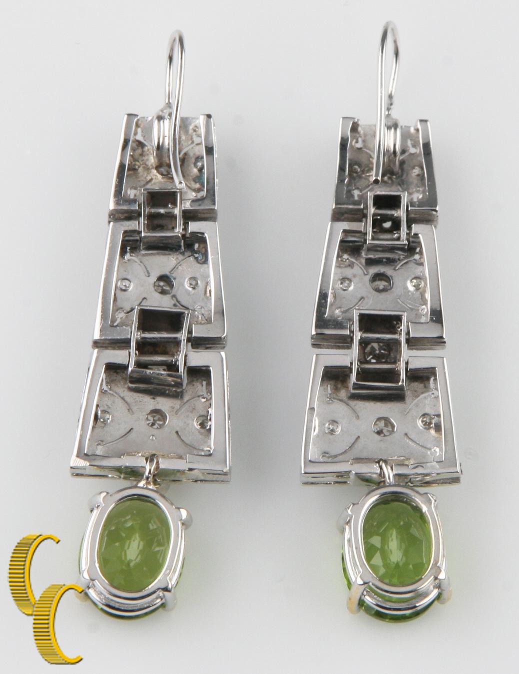Gorgeous Unique Art Deco Style Jewelry
Feature Three 14k White Gold Plaques Encrusted w/ Round Brilliant Diamonds 
Total # of Diamonds = 24
Approximate Carat Weight = 0.90 ct
Average Color = H - I
Average Clarity = SI
Prong-Set Oval-Cut Green