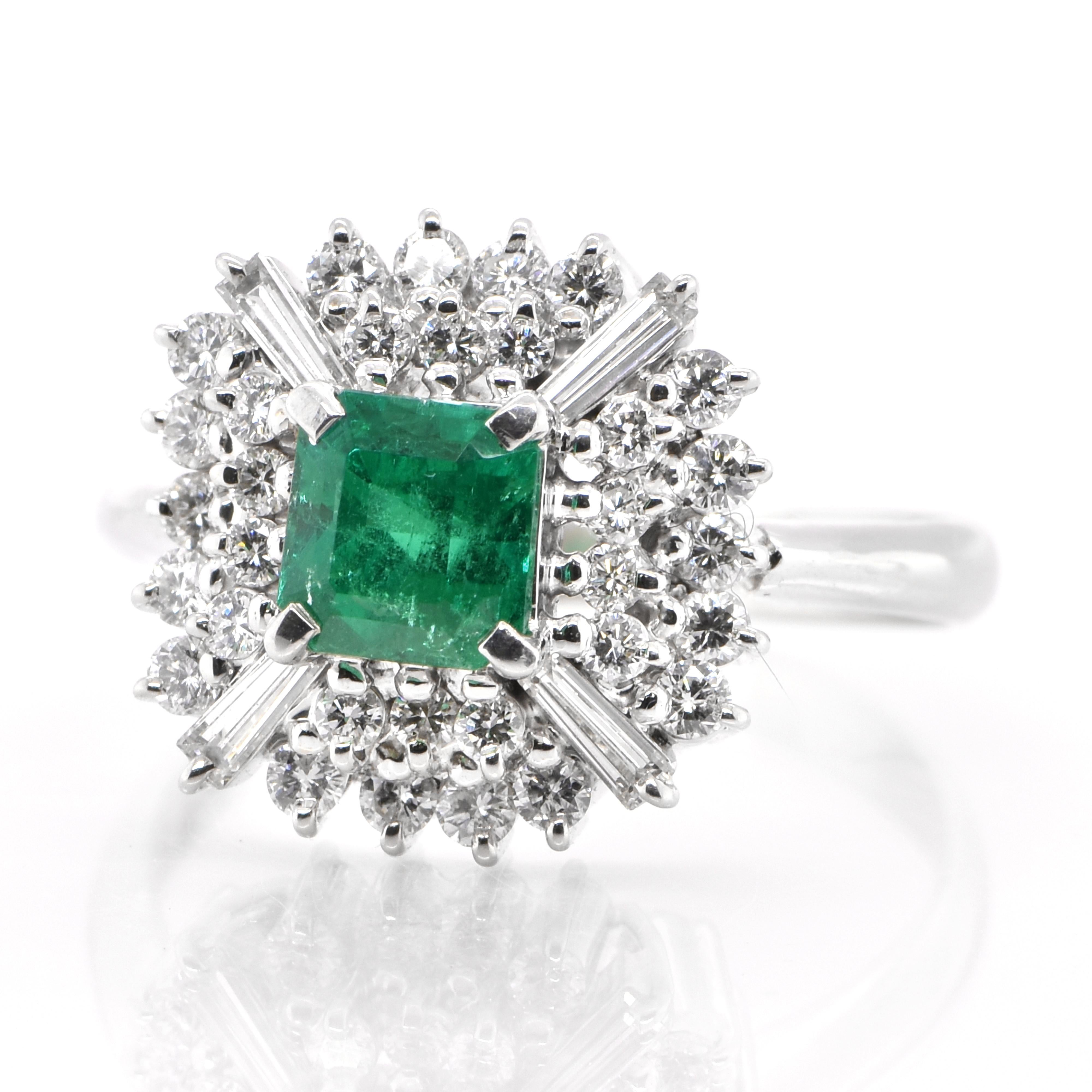 A stunning Art Deco inspired Ring featuring a 0.41 Carat Natural Emerald and 0.90 Carats of Diamond Accents set in Platinum. People have admired emerald’s green for thousands of years. Emeralds have always been associated with the lushest landscapes
