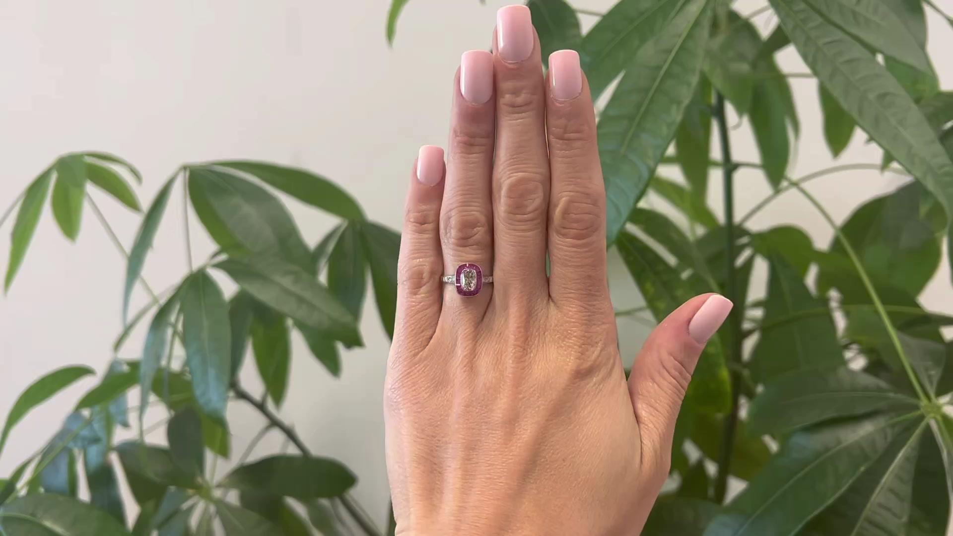 One Art Deco Inspired 0.84 Carat Old Mine Cut and Ruby Platinum Ring. Featuring one elongated old mine cut diamond of 0.84 carat, graded L color, VS2 clarity. Accented by 16 calibré cut rubies with a total weight of approximately 1.50 carats, and