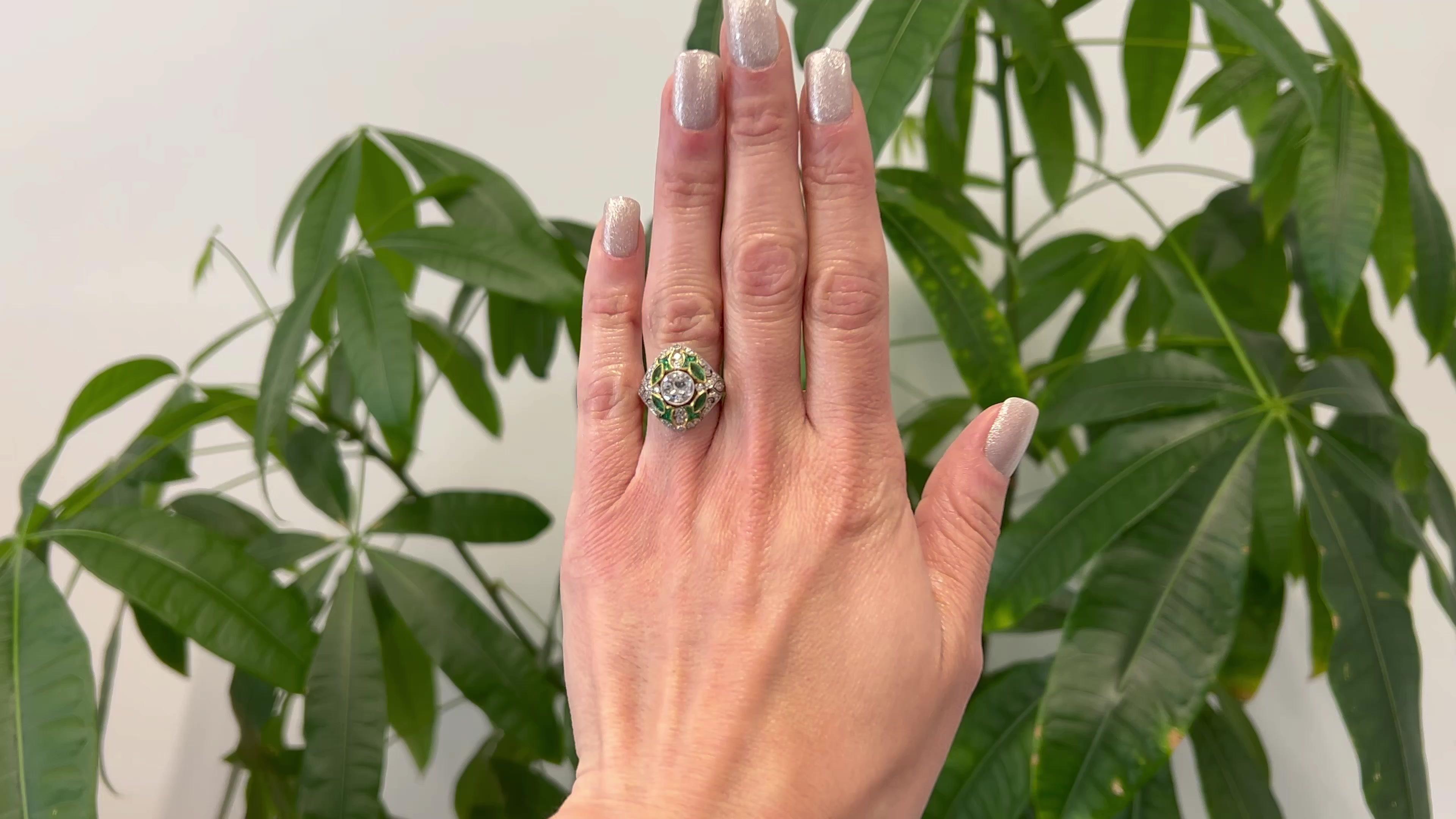 One Art Deco Inspired 1.08 Carat Diamond and Emerald Platinum Filigree Ring. Featuring one transitional cut diamond of 1.08 carats, graded H color,  I1 clarity. Accented by four marquise cut and 12 calibré cut emerald with a total weight of