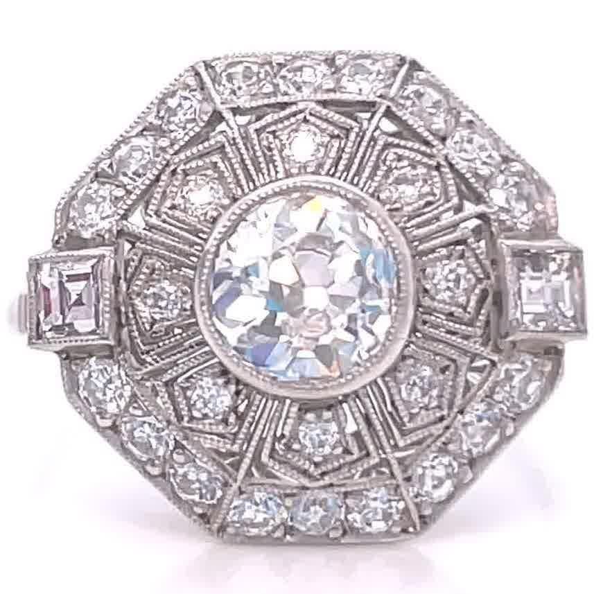 Beautiful Art Deco inspired engagement ring. Featuring a 1.11 carat old European cut diamond approximately I-J color, SI1 clarity. With 32 accenting old European cut diamonds that weigh approximately 0.56 carats, H-I color, VS-SI clarity. Also