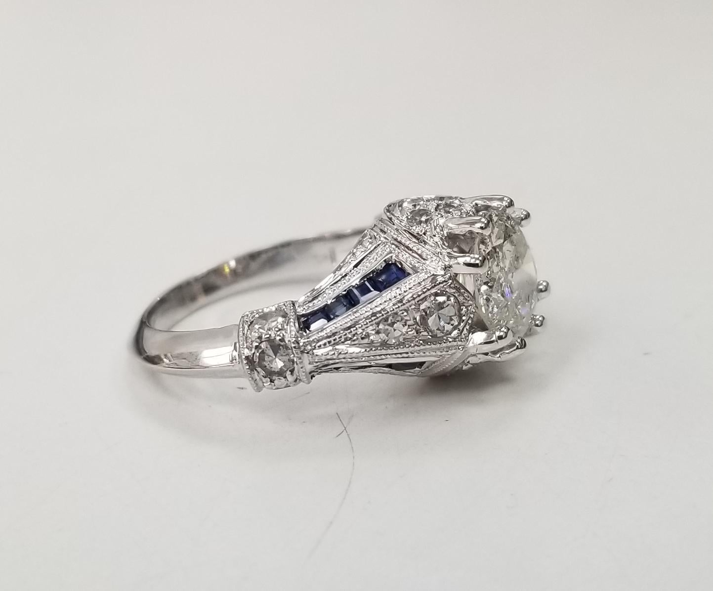 Art Deco inspired 14k white gold with diamonds-sapphires, containing 1 euro cut diamond: color 