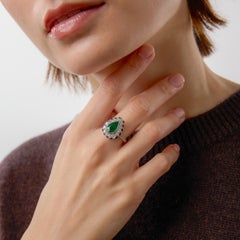 Art Deco inspired 1.56 carat pear shape emerald diamond platinum onyx ring