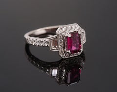 Art Deco-inspired 1.8 Carat Emerald-Cut Rubellite and Diamond Halo Ring