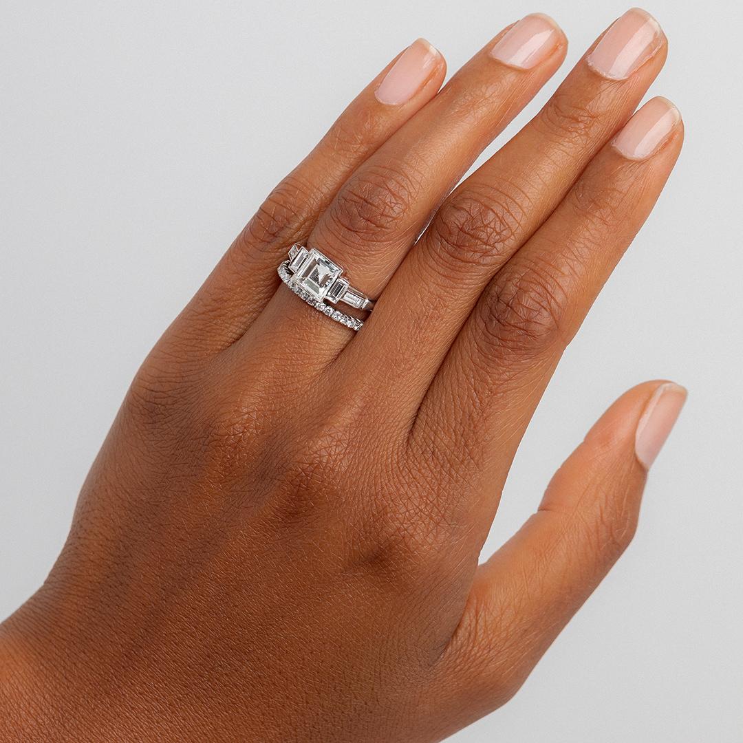 This is an extraordinary platinum engagement ring that was handmade by a master jeweler in downtown Los Angeles. This incredible ring is reminiscent of the geometric and linear principles of Art Deco design, and this one-of-a kind piece is 100%