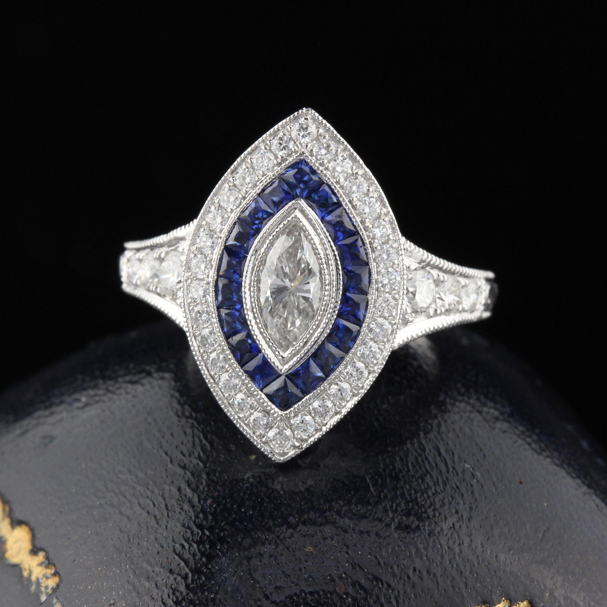 Beautiful Art Deco style ring in 18K White Gold with GIA Marquise shaped diamond and channel set natural sapphires! This ring is hand engraved and mil-grained. 

Item #R0046

Metal: 18K White Gold

Center Diamond Weight: 0.58cts

Center Diamond