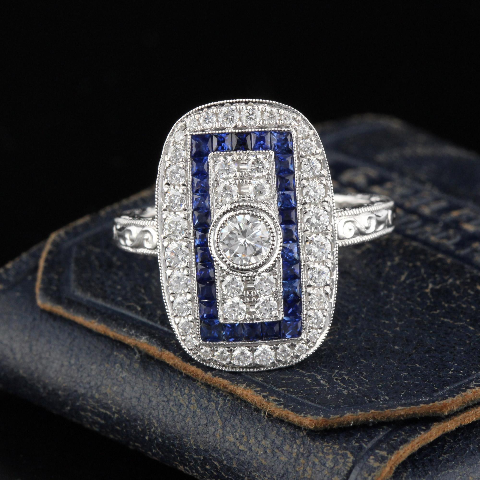Beautiful Art Deco style ring in 18K White Gold with diamonds and channel set natural sapphires! This ring is hand engraved and mil-grained.

Item #R0047

Metal: 18K White Gold

Center Diamond Weight: 0.25 cts 

Total Diamond Weight: 0.73