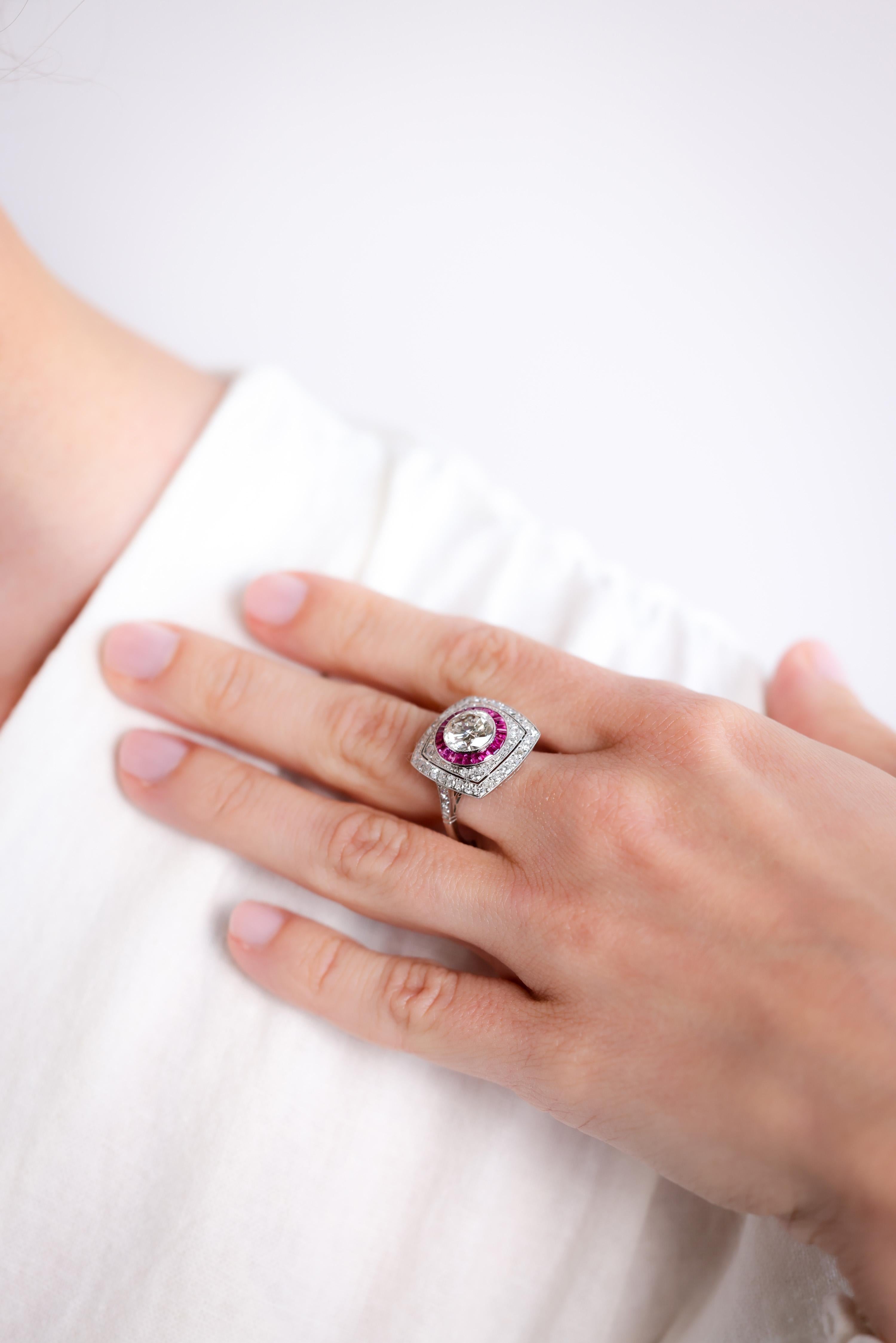 Center Stone: Diamond
Cut: Round Brilliant
Weight: 1.94 Carat
Color: K, Faint Brown
Clarity: SI2
Accent Stone: 50 Diamonds
Cut: Old Mine, Single
Weight: Approximately 1.5 Carats
Color: H-I
Clarity: SI
Accent Stone: 22 Rubies
Cut: Trapezoid
Weight:
