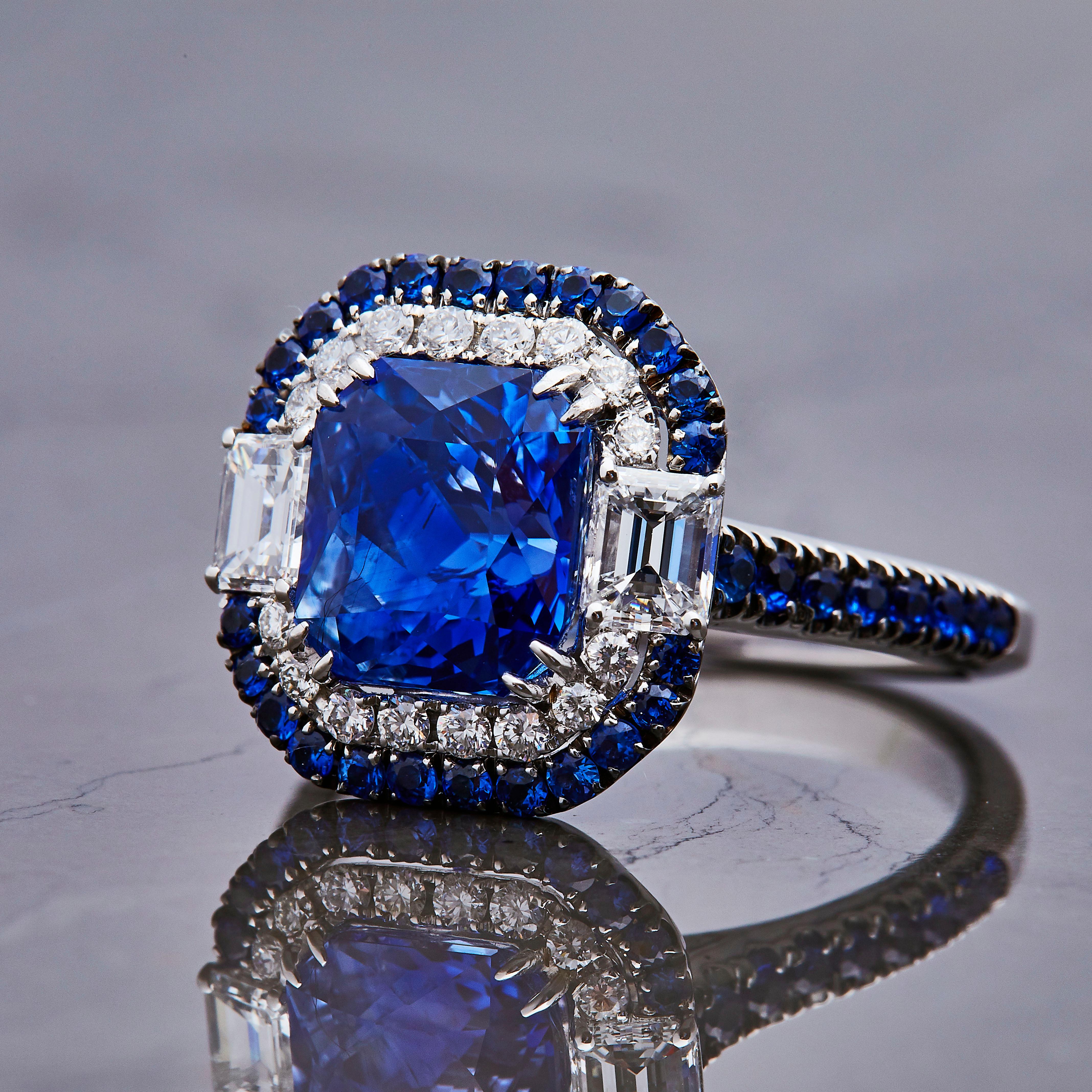 This is about as sophisticated and stunning of a sapphire piece as we could imagine. It all starts at the heart with a stunning center stone, 4.11ct certified 