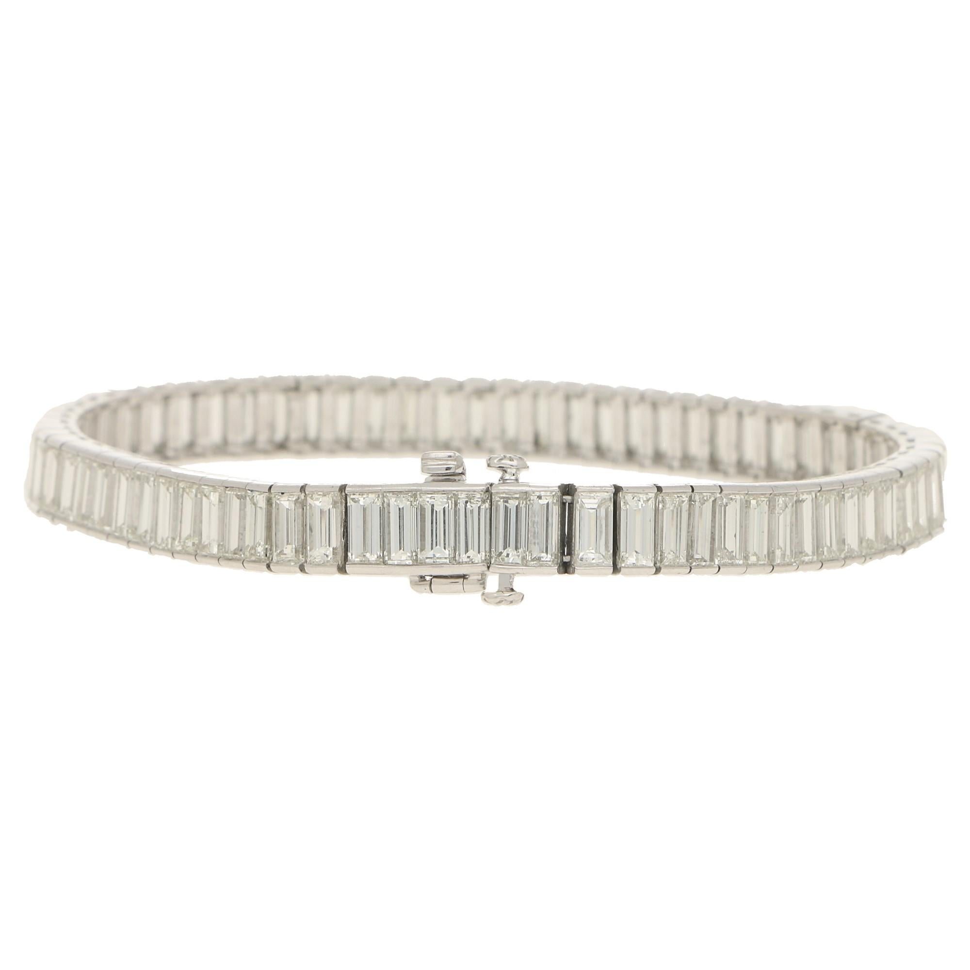 A magnificent Art Deco inspired baguette cut diamond line bracelet set in platinum. 

This stunning bracelet is composed of exactly 72 sparkly baguette cut diamonds all of which are rub over set individually in articulated links. Due to the design