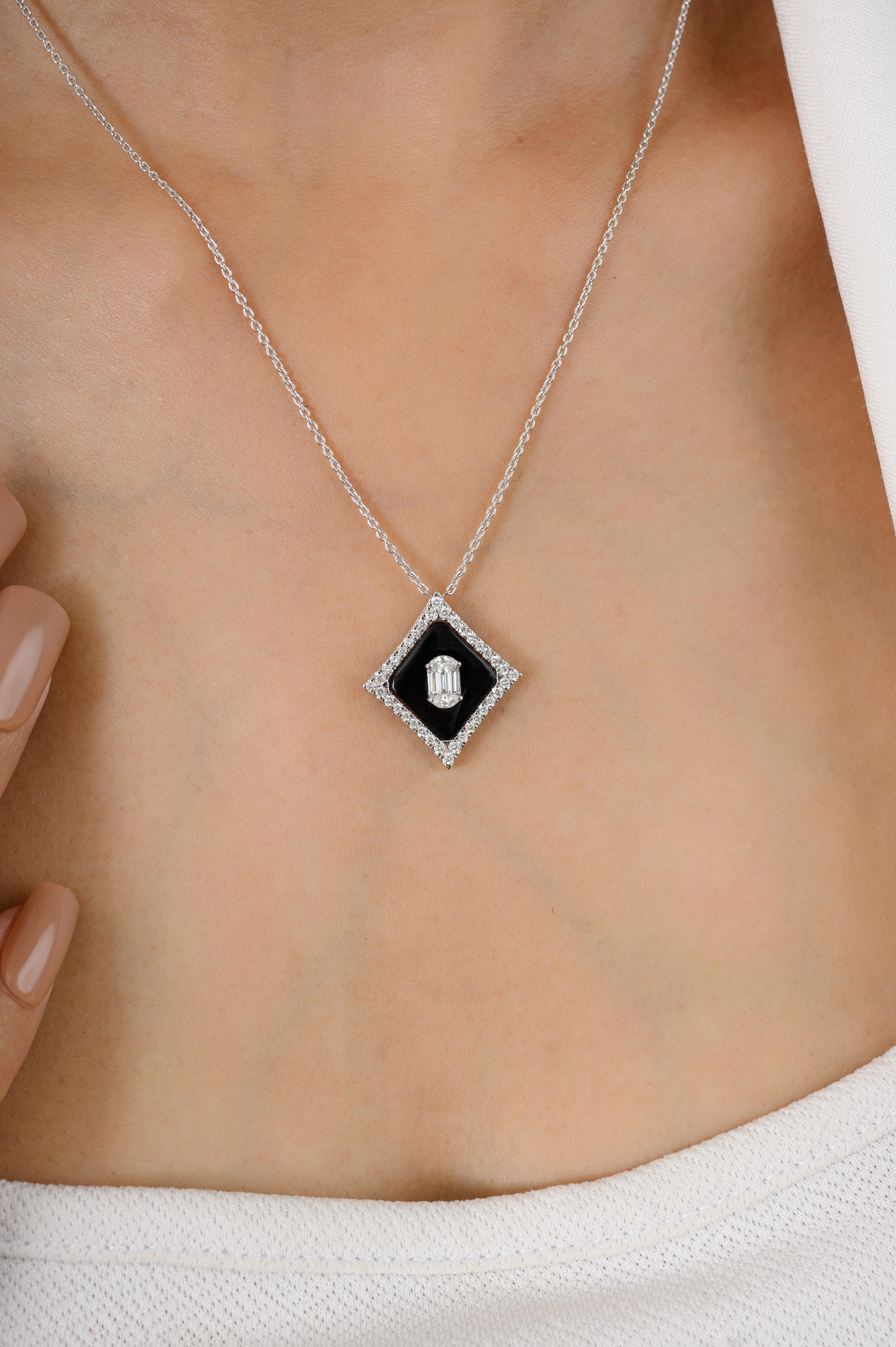 Art Deco Inspired Black Onyx Diamond Pendant Necklace in 18K gold studded with fancy cut onyx and diamond. This stunning piece of jewelry instantly elevates a casual look or dressy outfit. 
Onyx gives energy of strong support and determination to