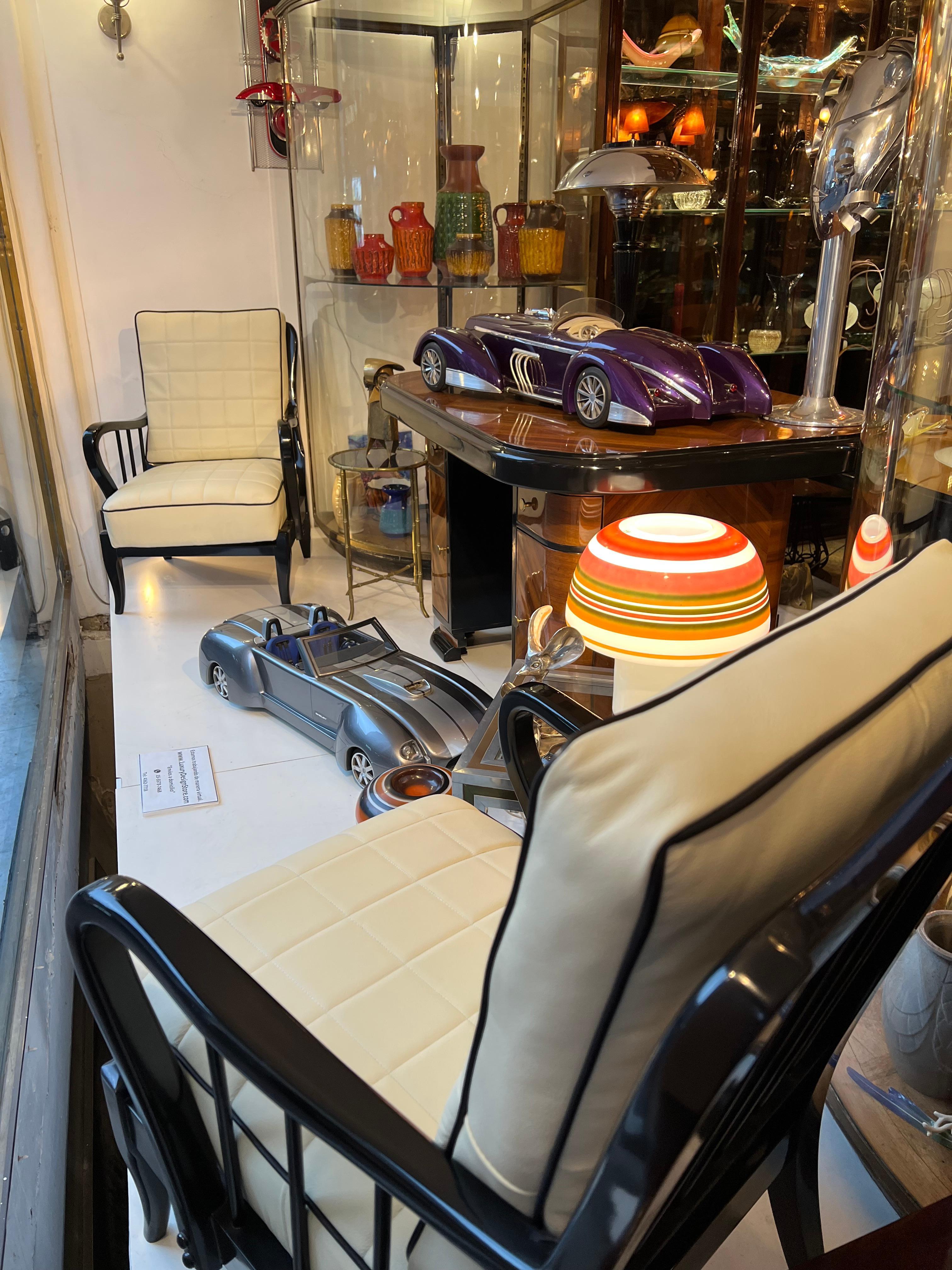 Incredible car: in solid wood. 

We have specialized in the sale of Art Deco and Art Nouveau and Vintage styles since 1982. If you have any questions we are at your disposal.
Pushing the button that reads 'View All From Seller'. And you can see more