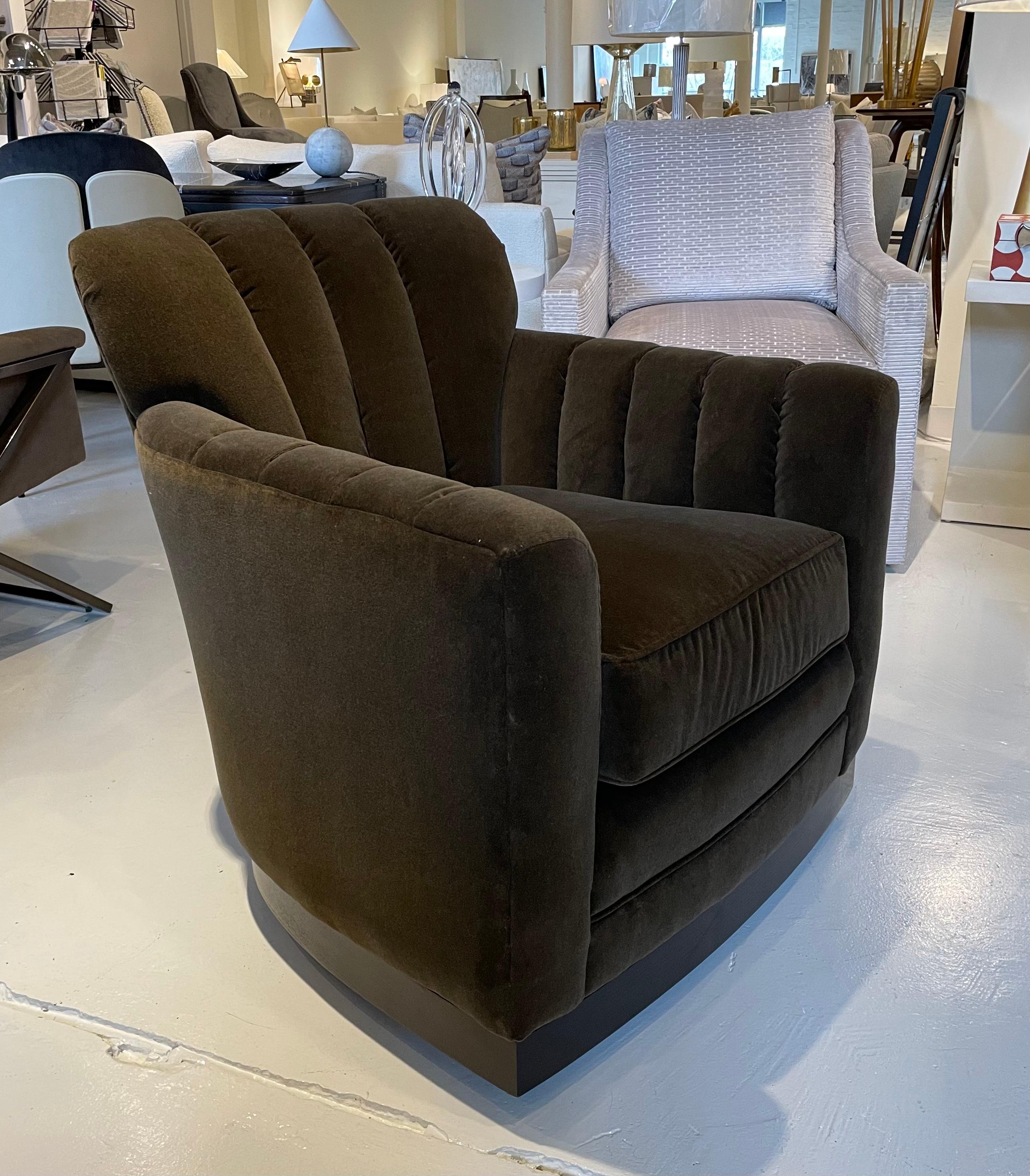 Showroom new. Paris swivel channel back chair. Wood swivel base with 360 degree swivel. Spring-down seat cushion - Premium cushion. Feels supportive, yet has down like softness. Covered in rich brown velvet.