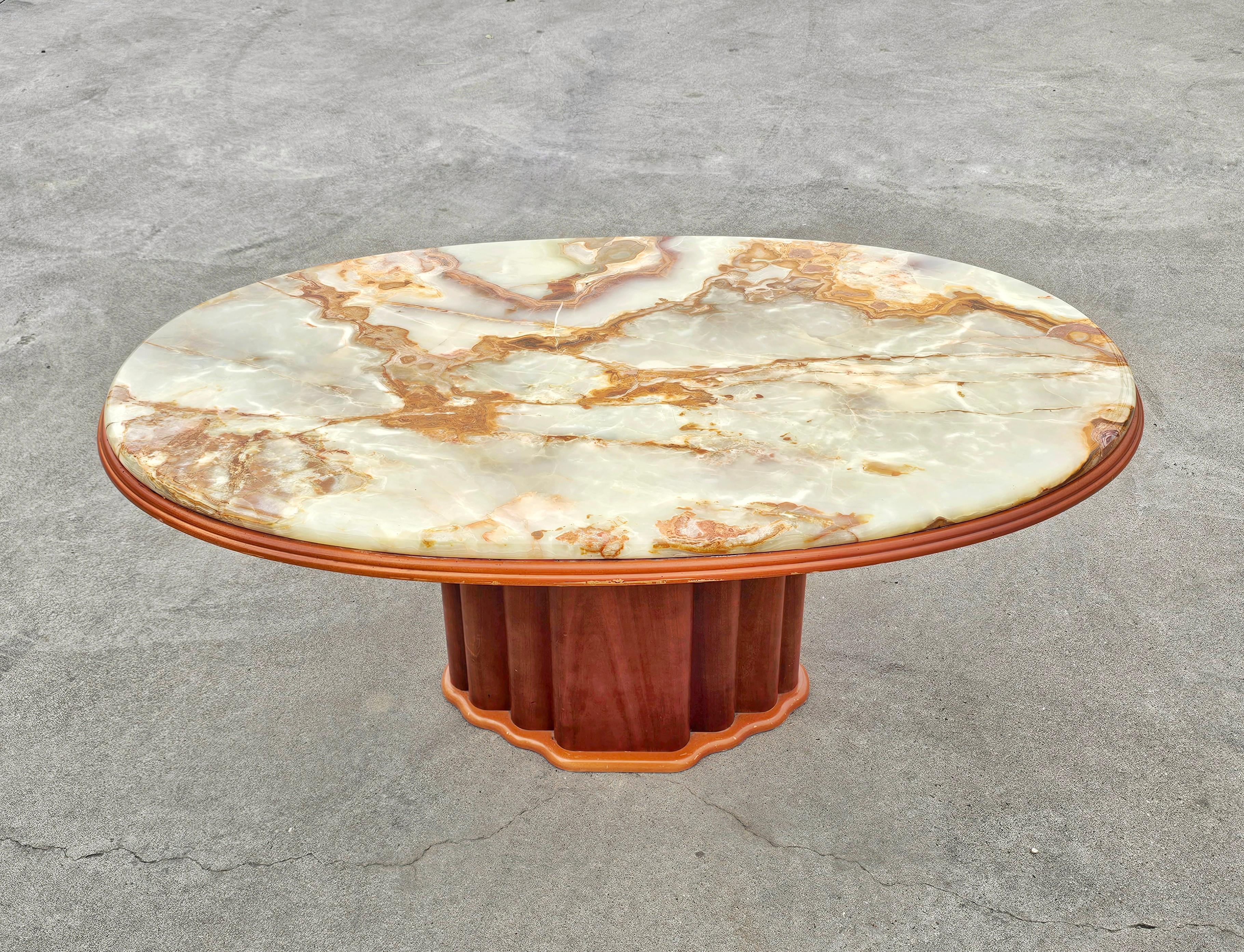 In this listing you will find an absolutely stunning Art Deco inspired coffee table. It features wooden base done in cherry wood with a gorgeous top done in Onyx marble with rich golden veins. Manufactured by Hohnert Design in West Germany in 1970s.
