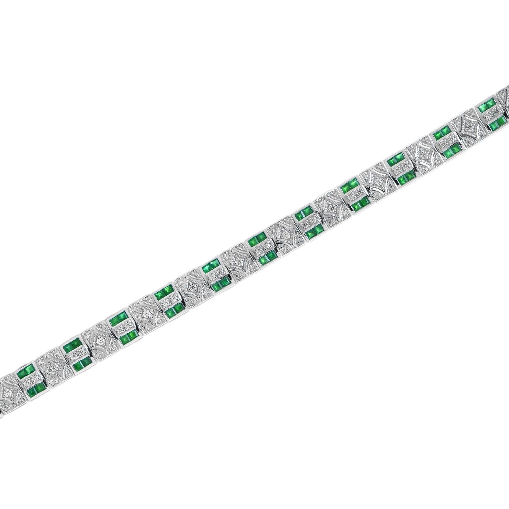 This art deco bar link bracelet is the epitome of vintage-inspired elegance featuring mesmerizing geometric patterns feature with emerald and diamonds. 14K White Gold. 
Bracelet Information
Width: 8 mm.
Length: 195 mm.
Weight: 20.0 g. (approx. in
