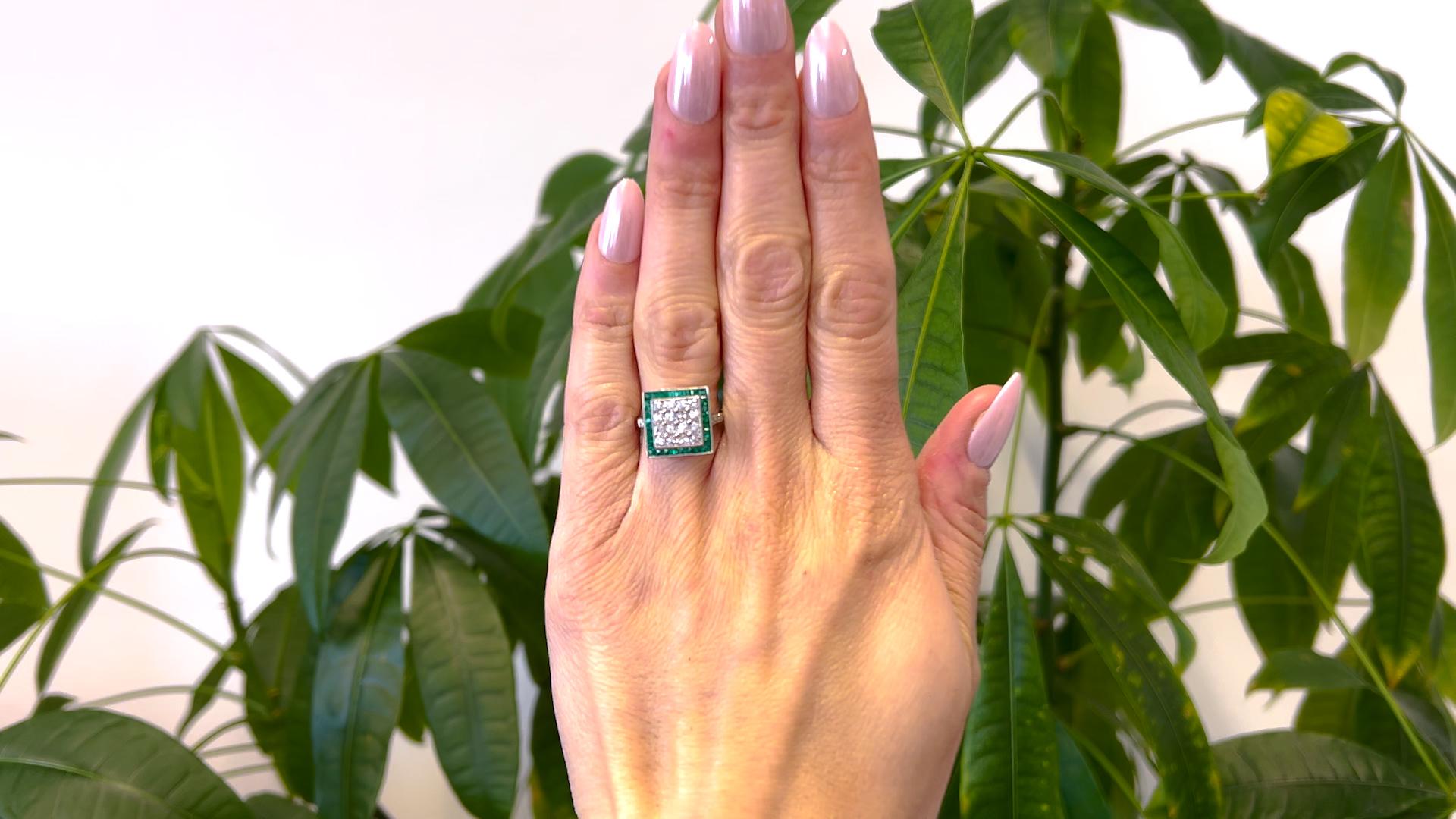 One Art Deco Inspired Diamond and Emerald Platinum Square Ring. Featuring 16 old mine cut diamonds with a total weight of approximately 1.20 carats, graded near-colorless, VS clarity. Accented by 32 French cut emeralds with a total weight of