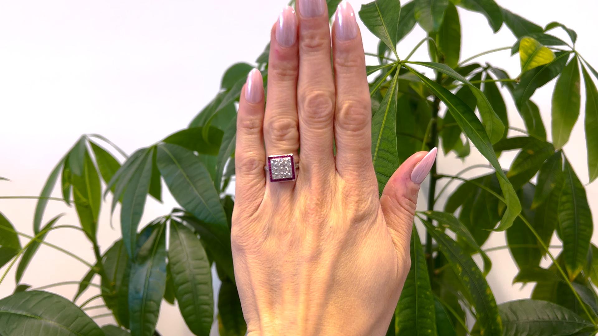 One Art Deco Inspired Diamond and Ruby Platinum Square Ring. Featuring 16 old mine cut diamonds with a total weight of approximately 1.20 carats, graded near-colorless, VS clarity. Accented by 32 French cut rubies with a total weight of