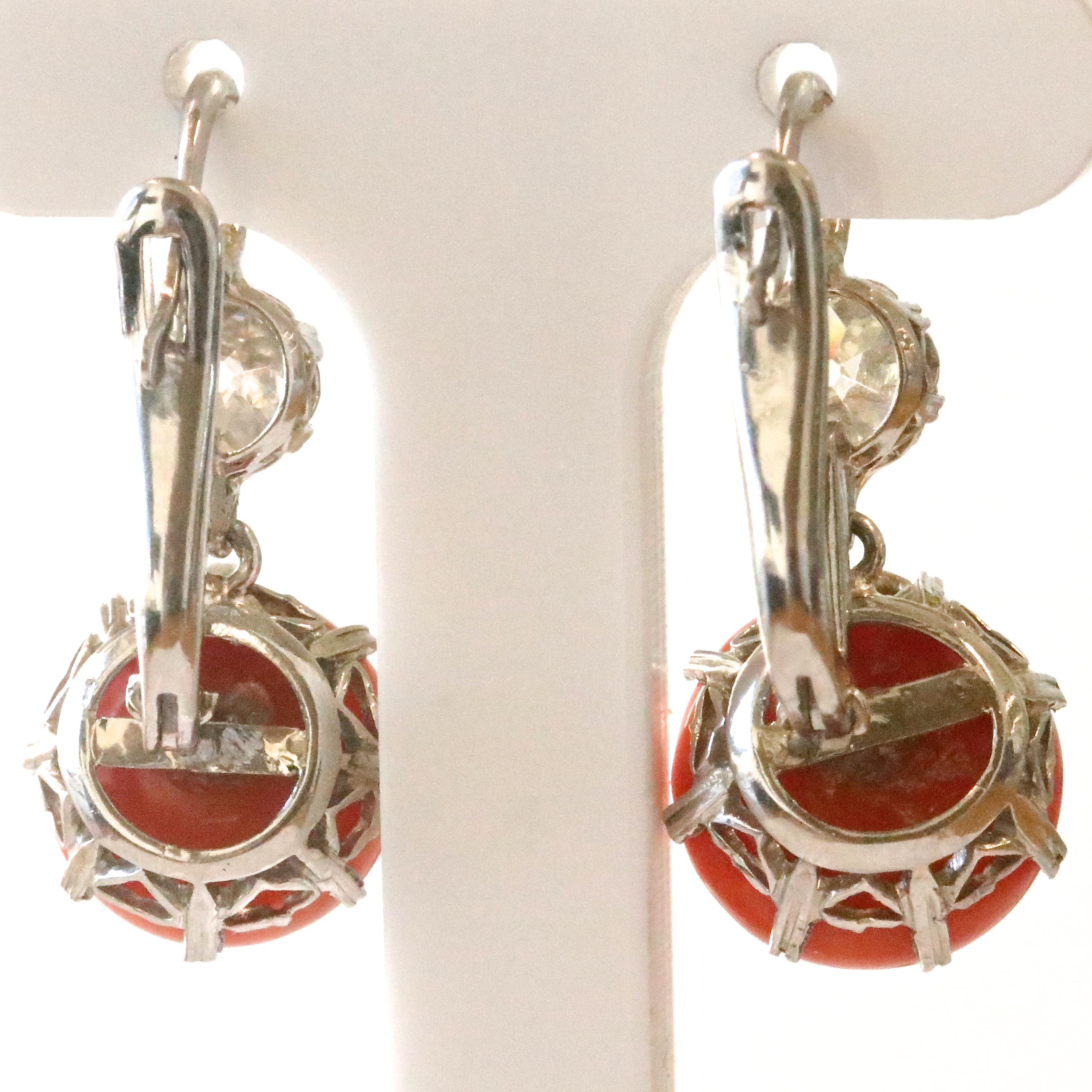 Fun and colorful, these earring will definitely add some spice to your look! Featuring polished coral spheres and 2 old mine cut diamonds approximately 0.50 carats each, I-J color, SI clarity. 

Flawless Protection Plan: 
-7-day return policy for a