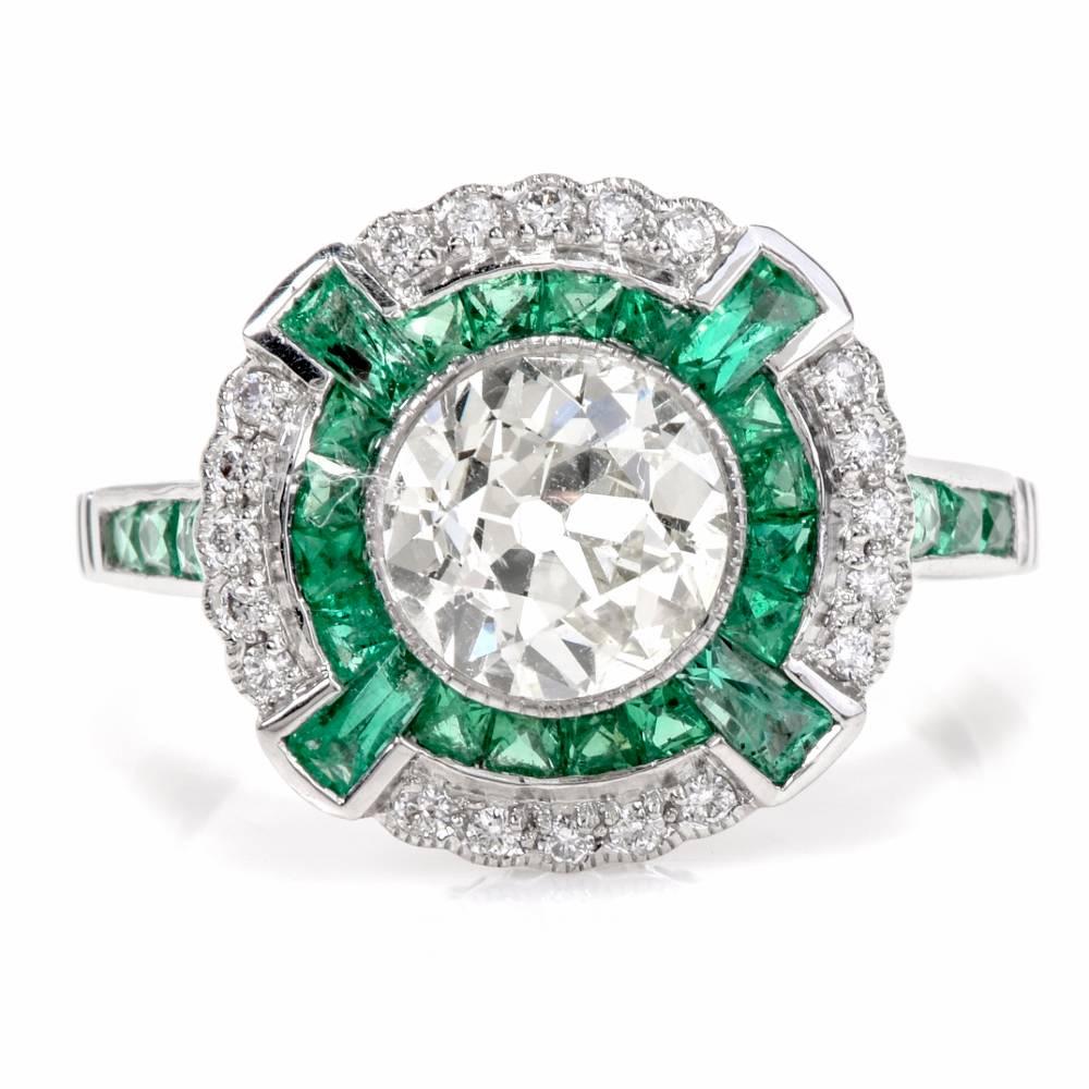 This classic engagement ring incorporates a color-contrasted orbicular plaque adorned with an eminent 1.40 carat old european round-faceted diamond at the center, graded J-K color and VS2 clarity, set within a finely mille-grained bezel. The