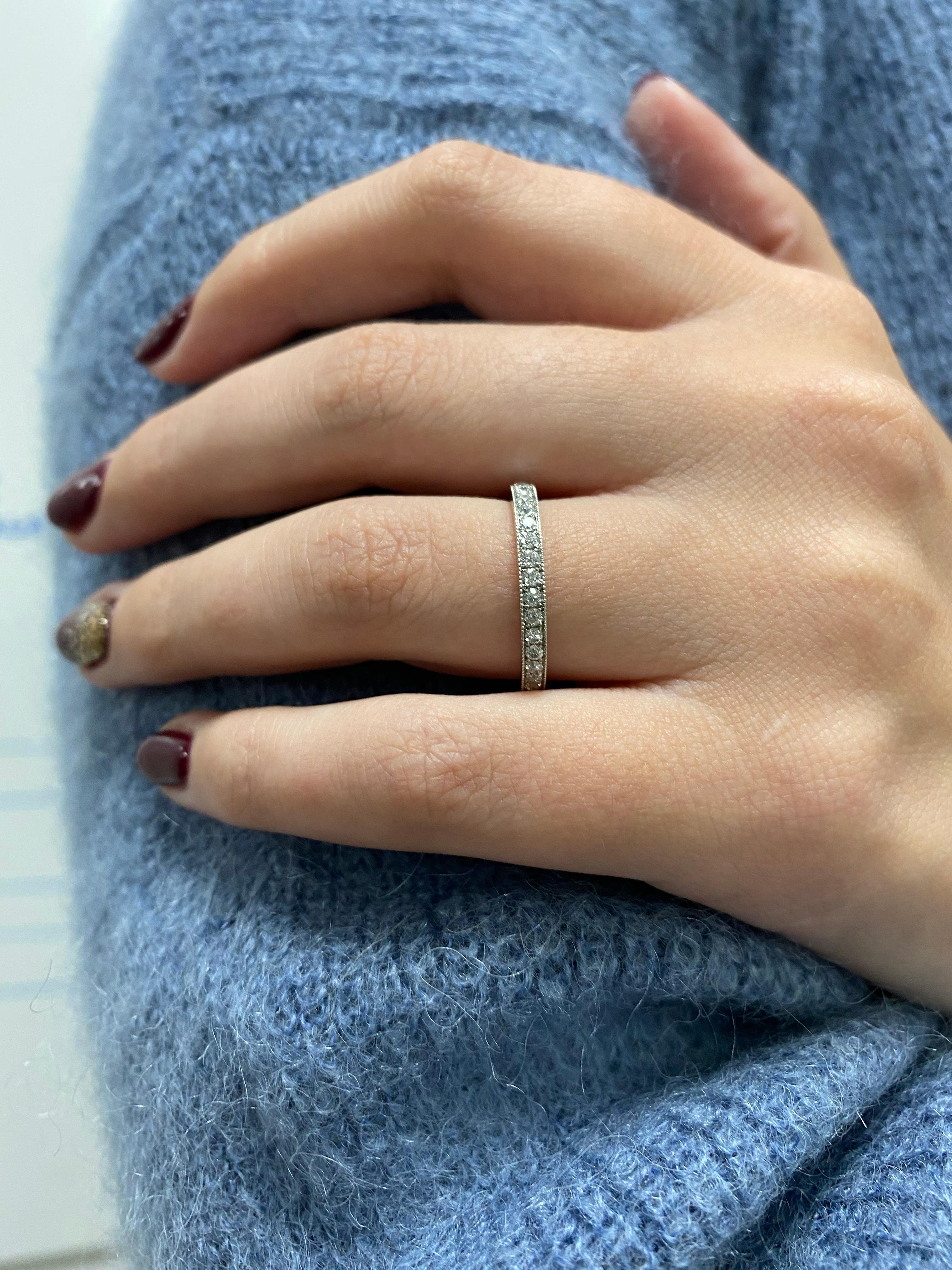 A classic diamond eternity ring for everyday, this lovely band will sit perfectly alongside other pieces or wow all on its own. 

Part of our Clara collection, the delicate platinum millegrain detail evokes the wonderful simplicity of Art Deco