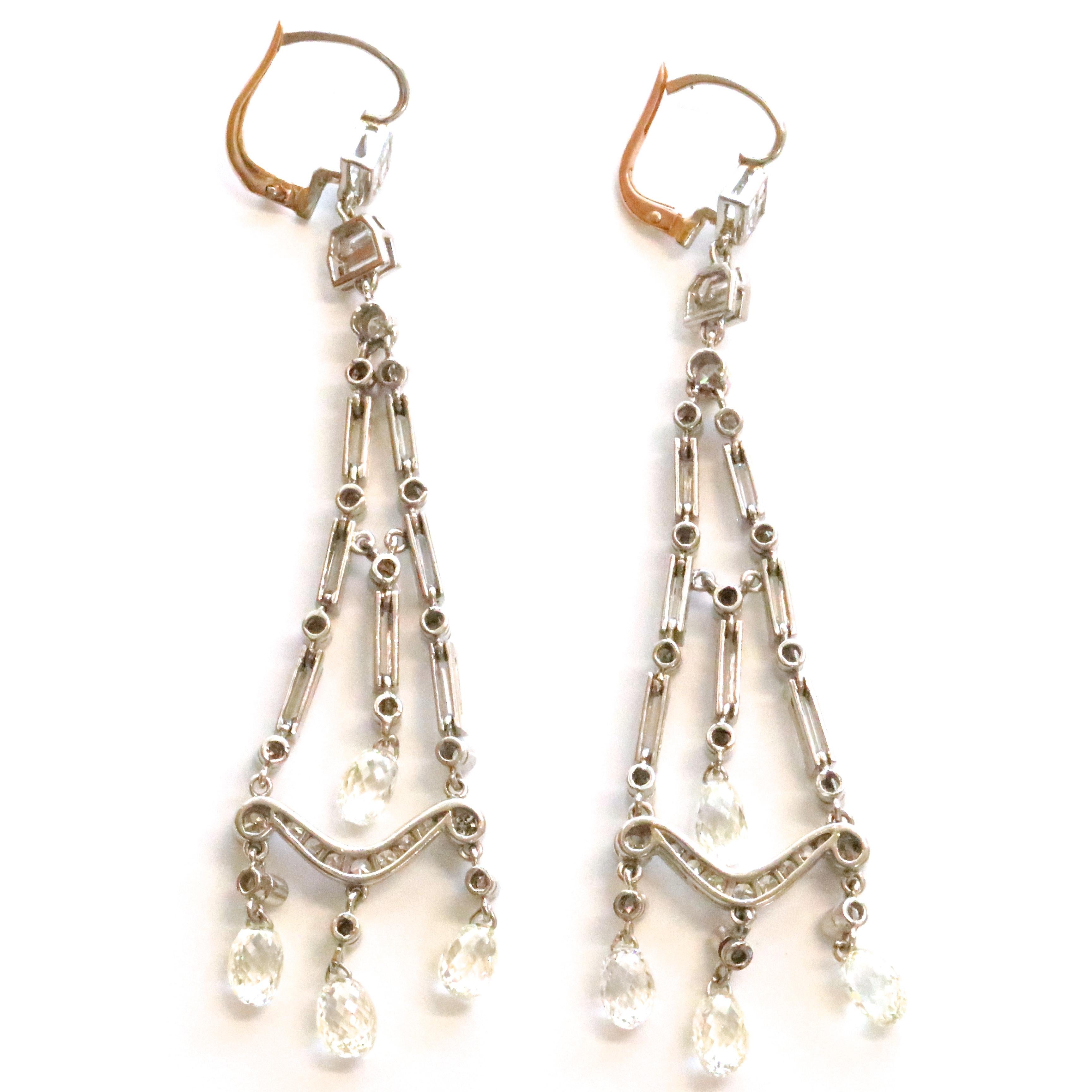 These new Art Deco style earrings realistically represents the design of the era. They can be worn for a night out or for a walk in the park. Even with a mask on they will still be noticed. Diamond Platinum Chandelier Earrings feature 8 carre cuts,