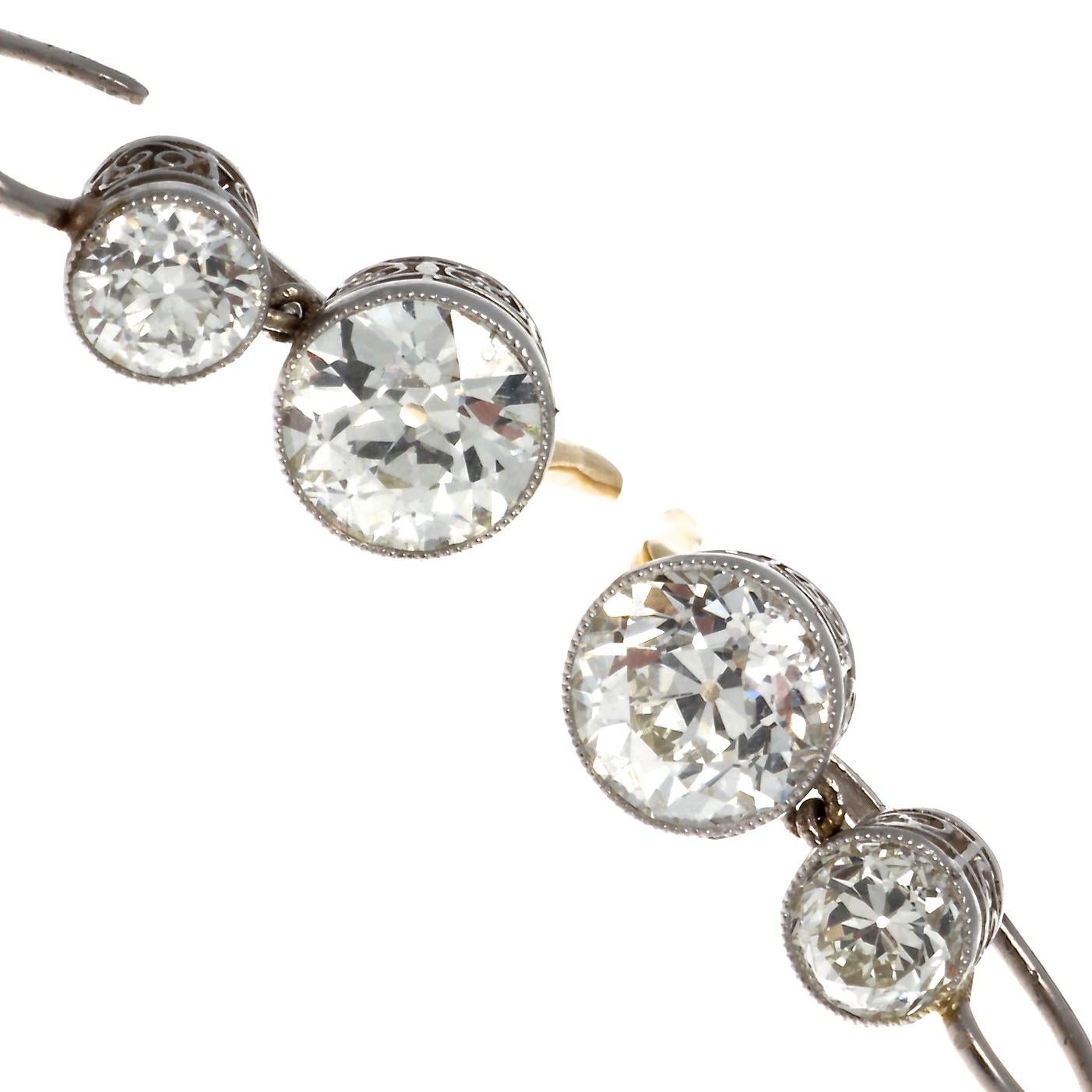Stunning Art Deco inspired old European cut diamond drop earrings. The 2 drop diamonds weigh 2.60 carats total, J-K color and VS clarity.  The 2 top diamonds  weigh 1.04 carats J-K color VS clarity.   Total weight of all diamonds are 3.64 carats.
