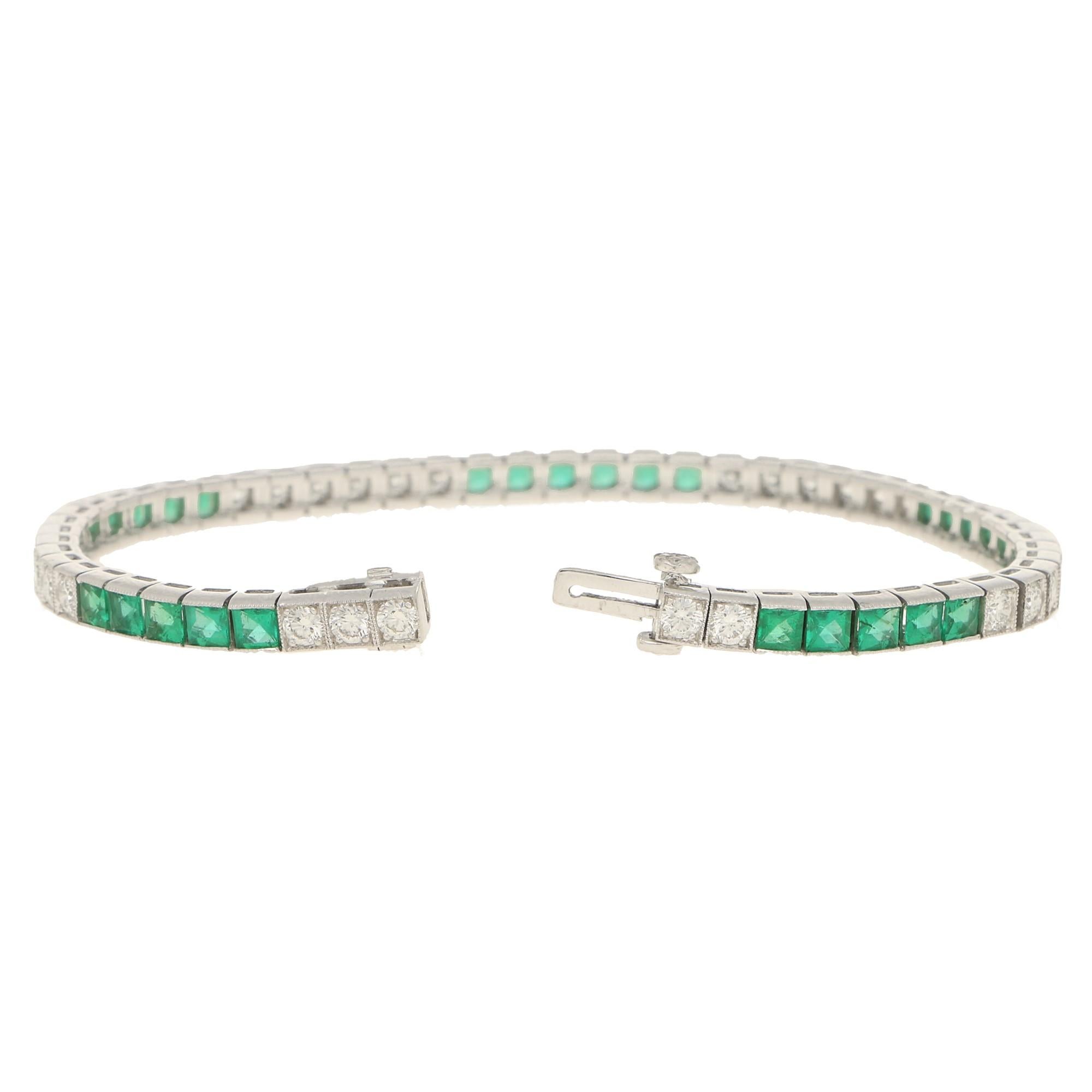 A beautiful Art Deco inspired emerald and diamond line bracelet set in platinum.

This stunning bracelet is composed of a perfectly balanced mixture of French cut emeralds and round brilliant cut diamonds; all of which are rub over set individually
