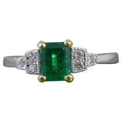 Art Deco Inspired Emerald Ring with Diamond Set Shoulders and Platinum Band